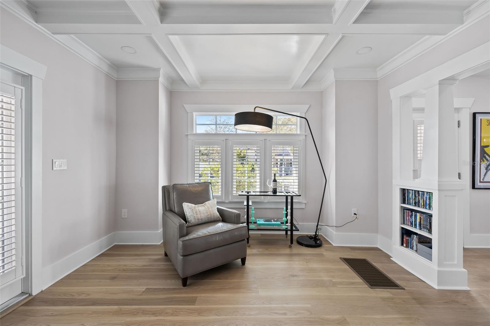 Well lit reading nook complete with shelving for your favorite books!