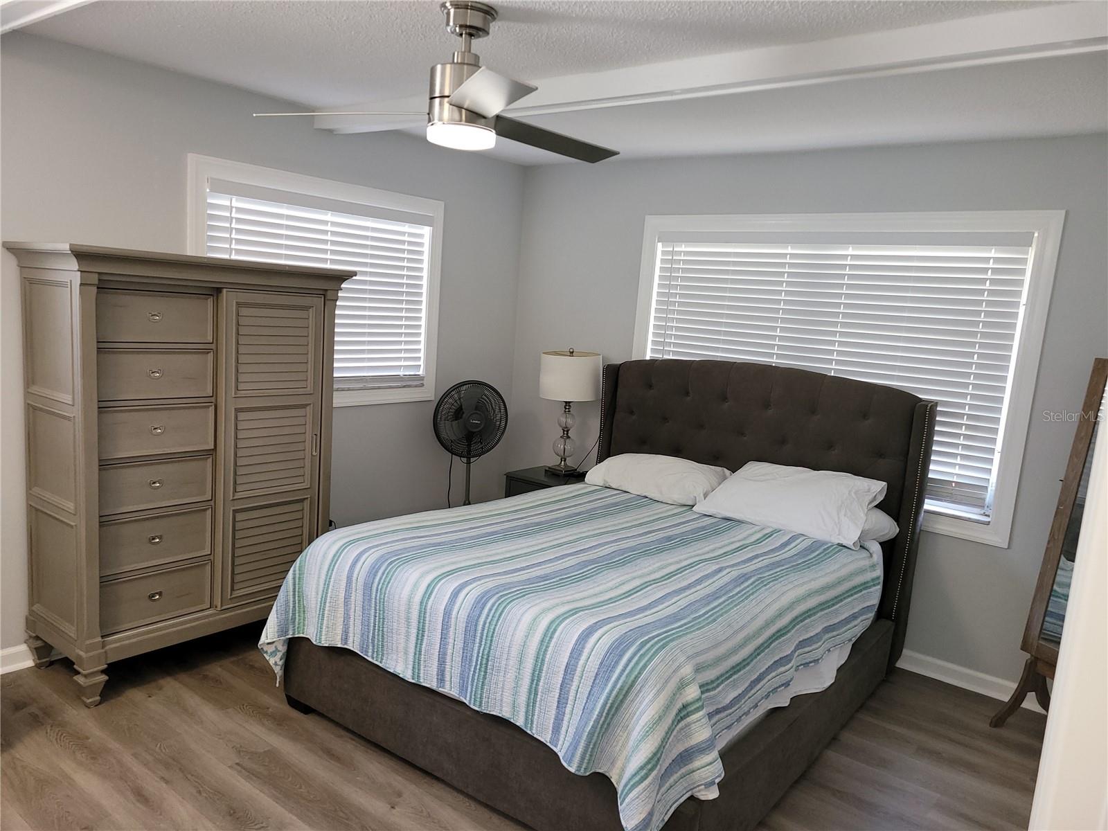 The same primary bedroom with furnishings in it from earlier this year.