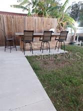 outdoor kitchen with bar stools