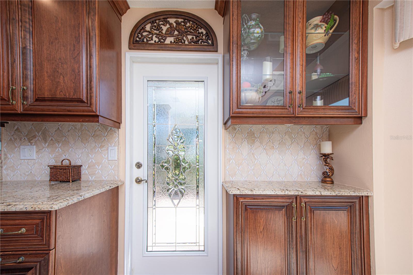 ETCHED KITCHEN DOOR LEADS TO SIDE & REAR PATIOS