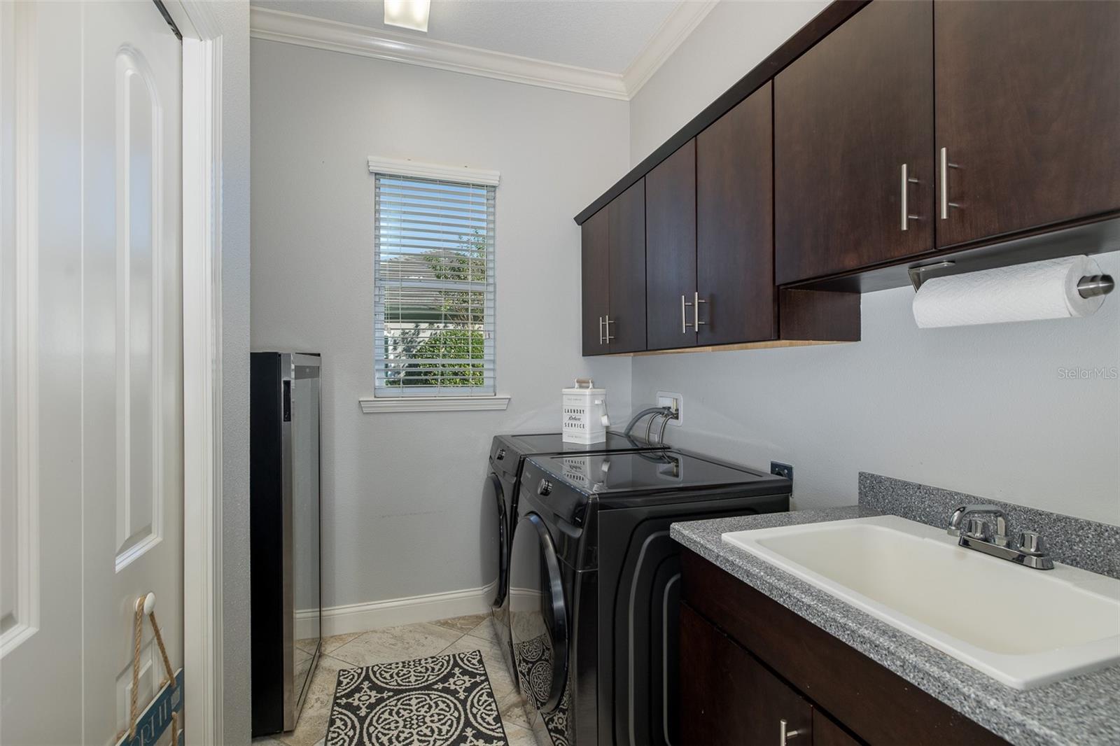 Laundry Room w/Cabinetry Utility Sink & Roomy Closet!