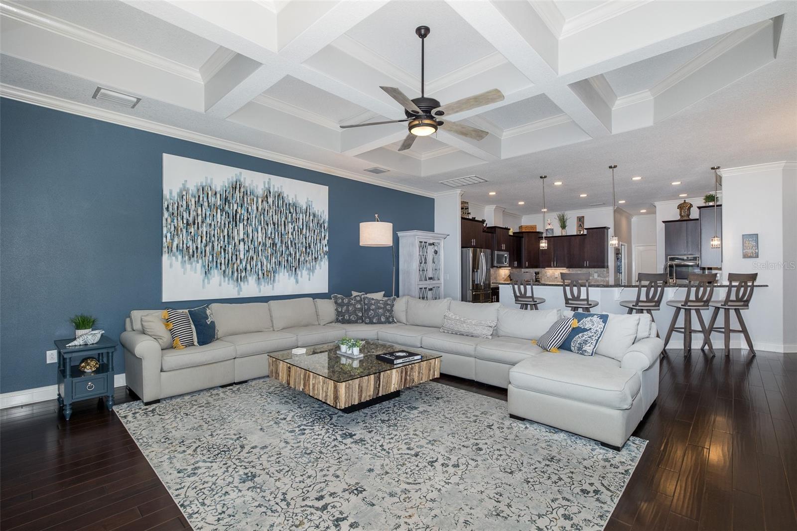 Inviting Family Room w/Custom Coffered Ceilings & Wood Flooring!