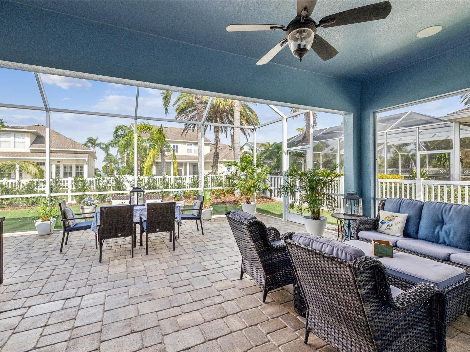 Built for relaxation and entertaining, this 680 sqft. lanai features a fully screened enclosure and pavers that extend the length of the rear elevation of the home.