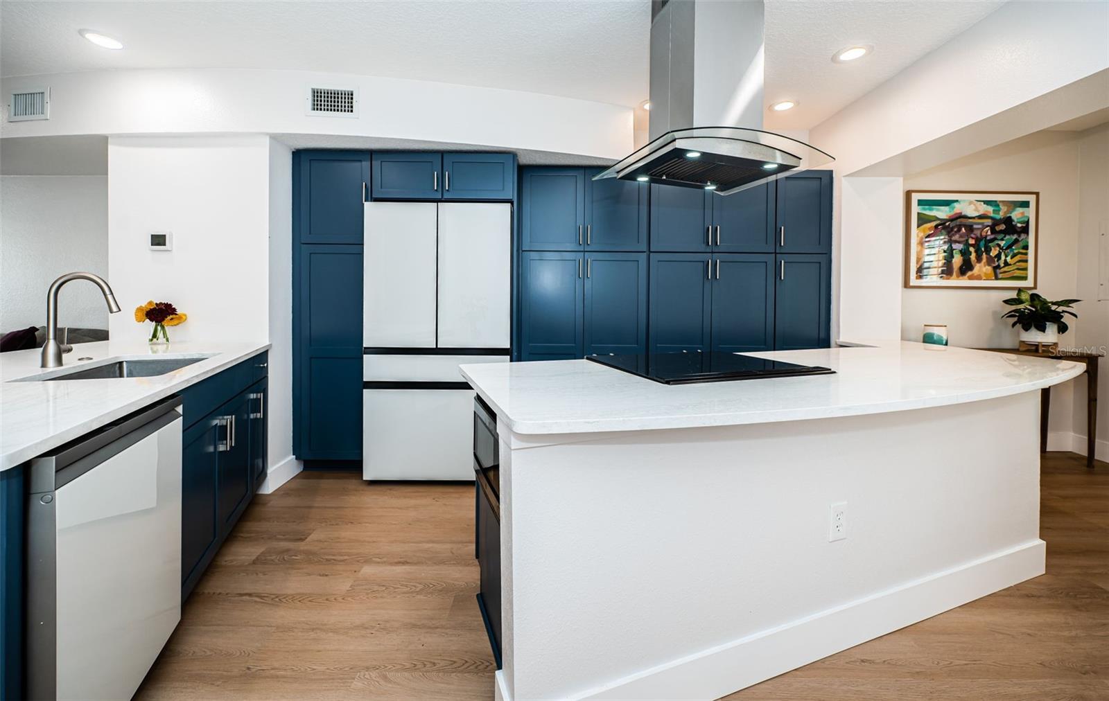 Tons of cabinet space and long counters make the perfect setting for cooking with friends.