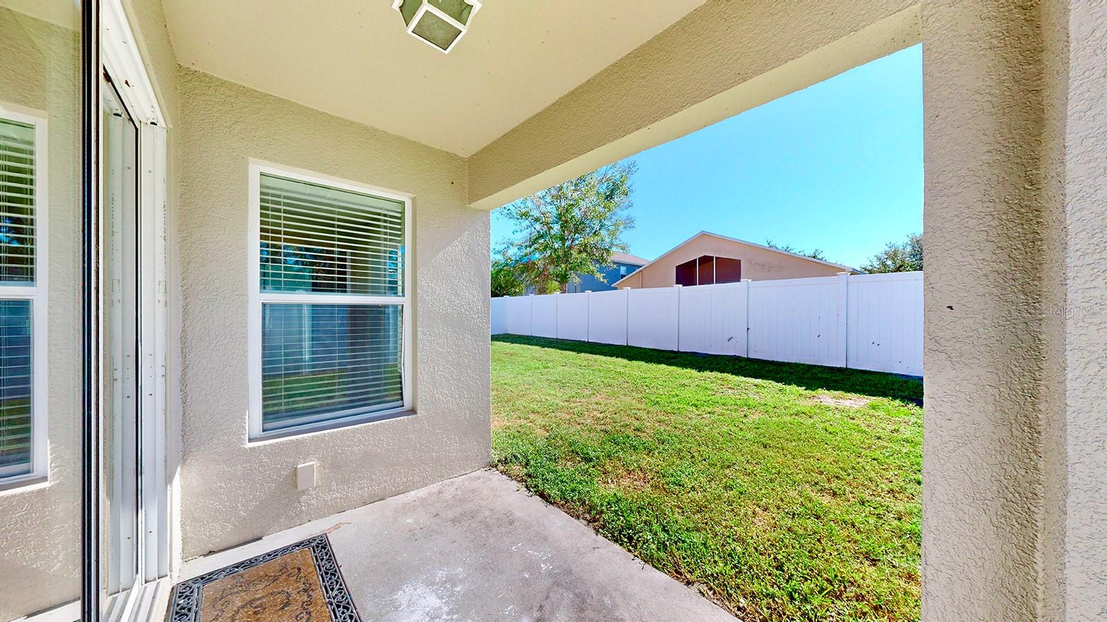 Covered Outdoor Space, Yard is wrapped in a maintenance free privacy fencing