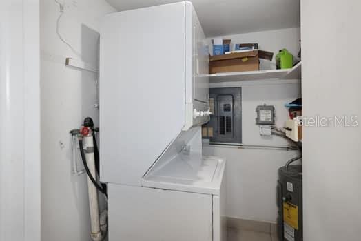 Utility room with stackable washer dryer