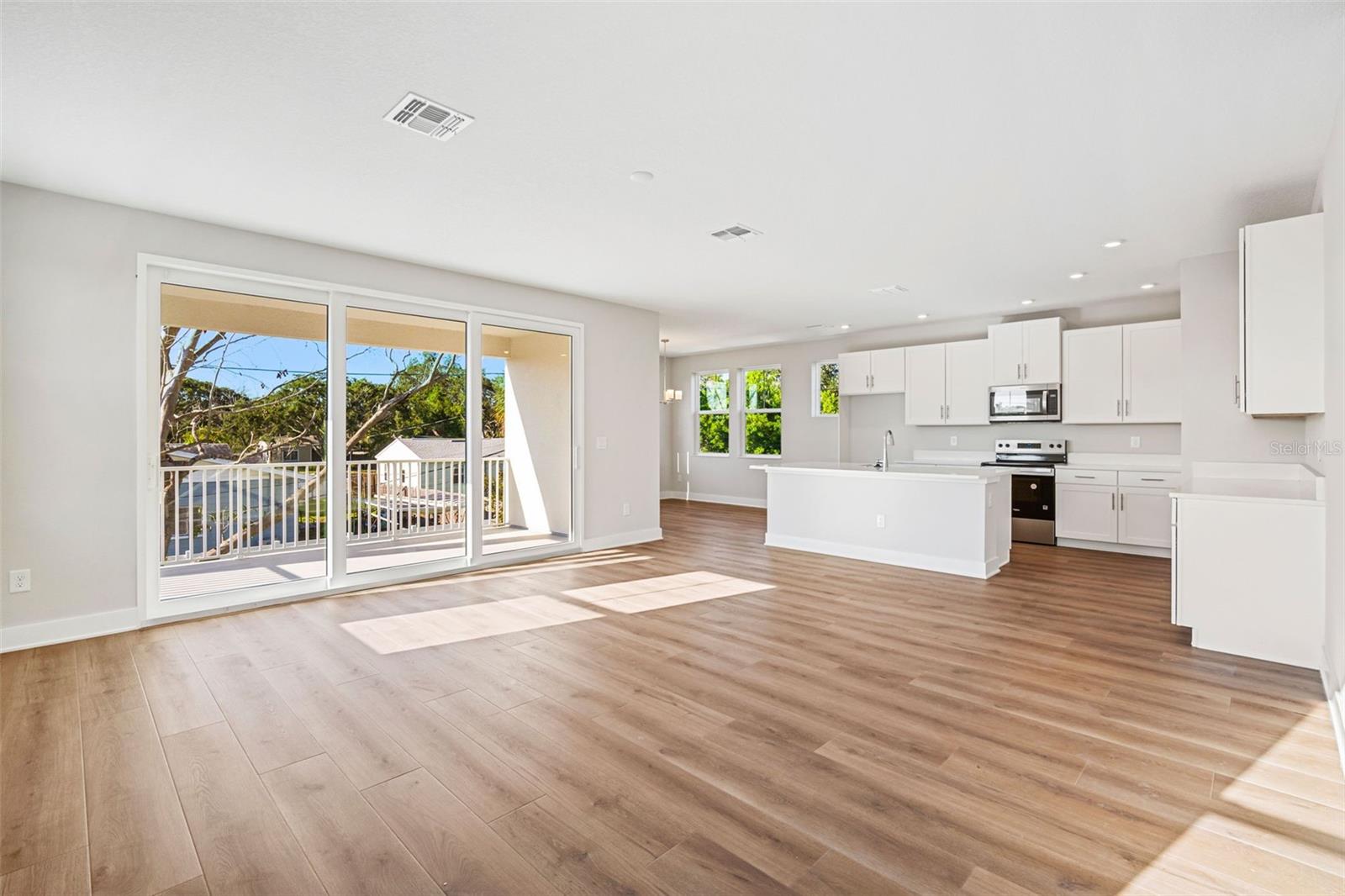 UPGRADED LUXURY VINYL PLANK FLOORING THROUGHOUT