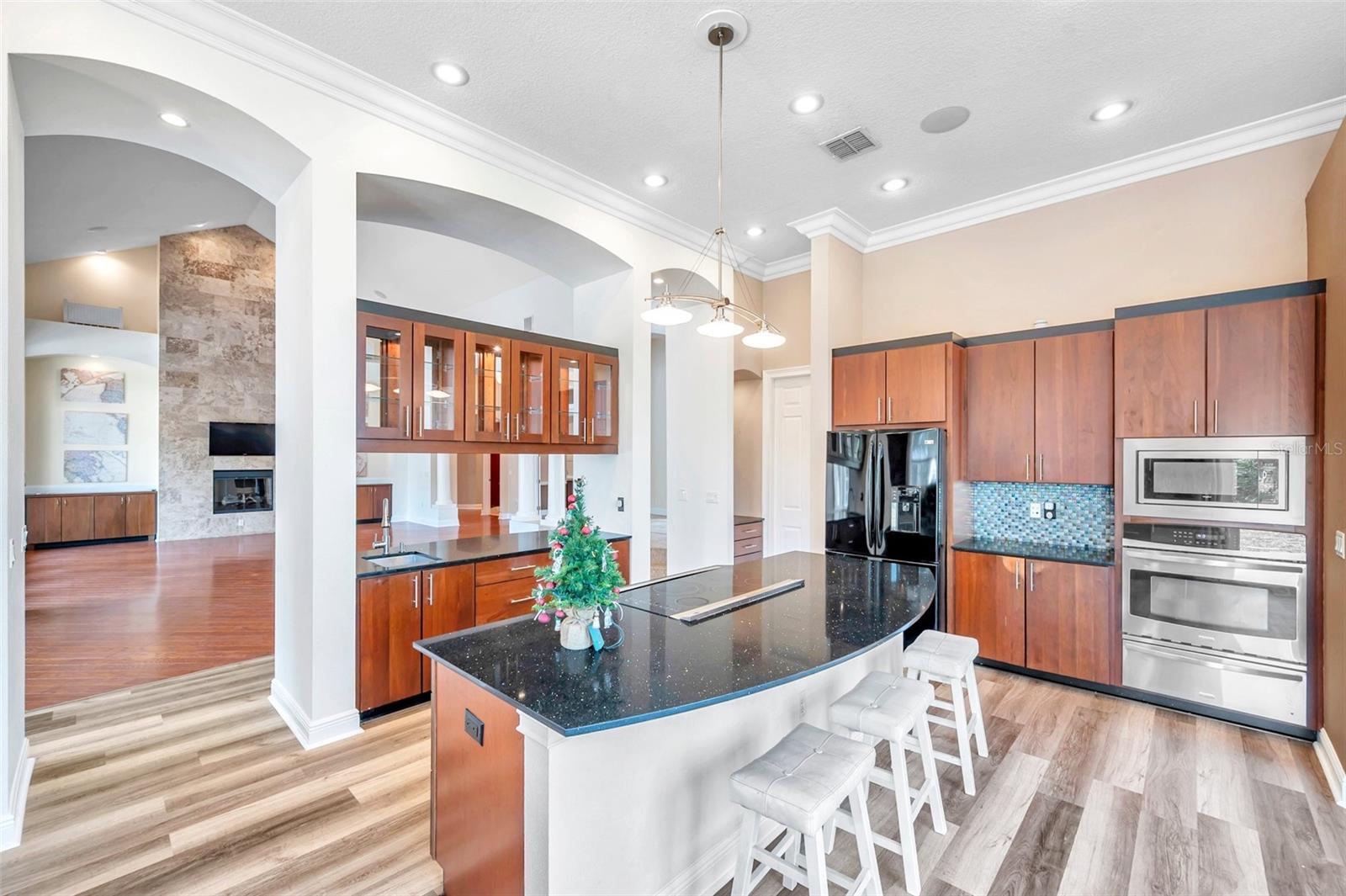 Kitchen wall oven and wood cabinets