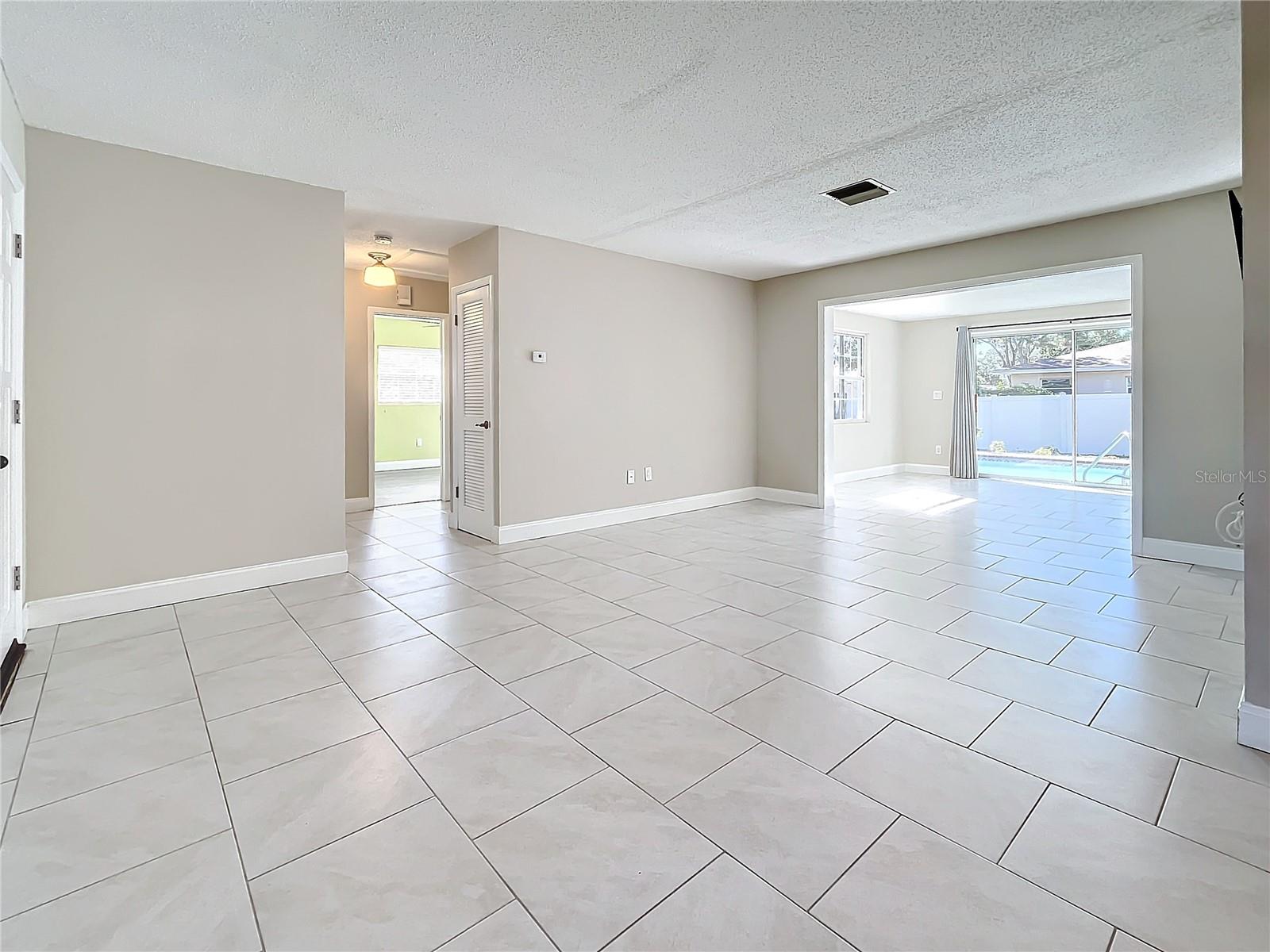 Living Room - Family Room - Outdoor Living and Pool Area