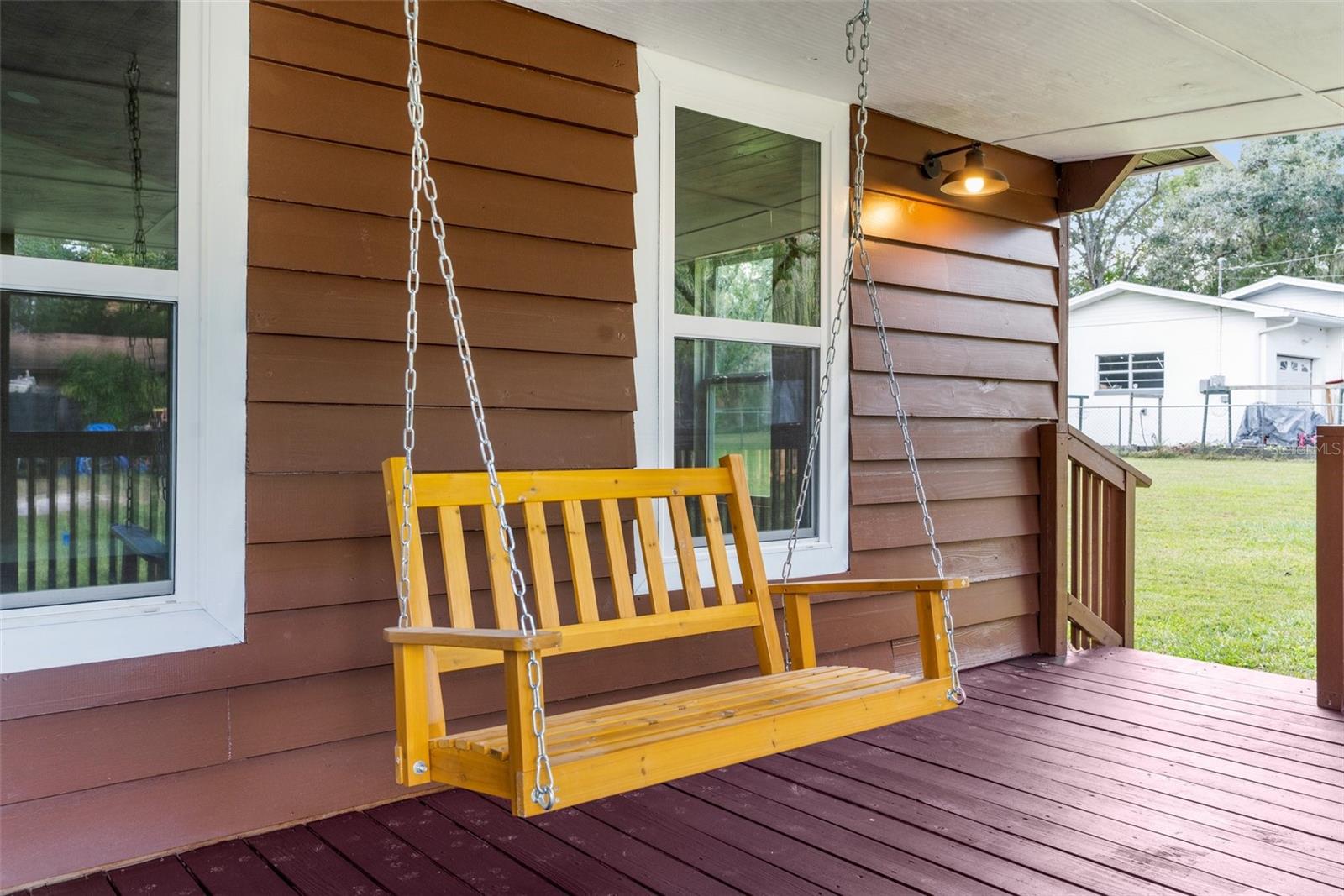 Porch swing to relax and enjoy the peaceful neighborhood.