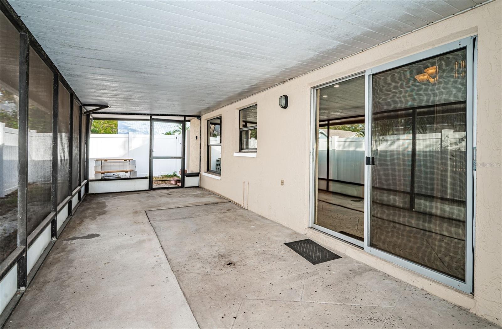 Covered back patio with sliders into dinette area