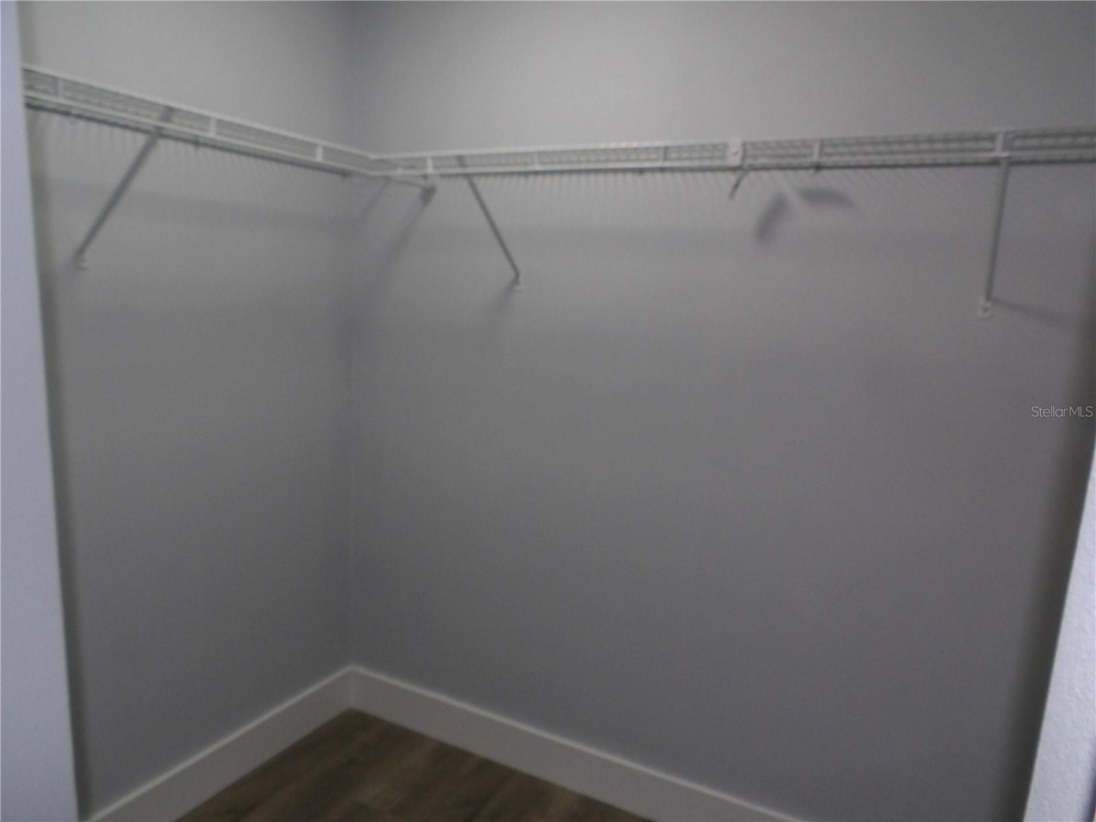 Walk In Closet In Primary Bedroom