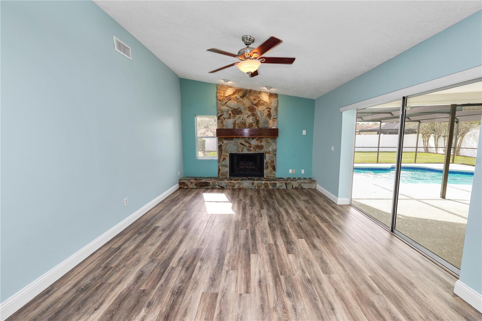 Family Room with sliders out to the Pool.