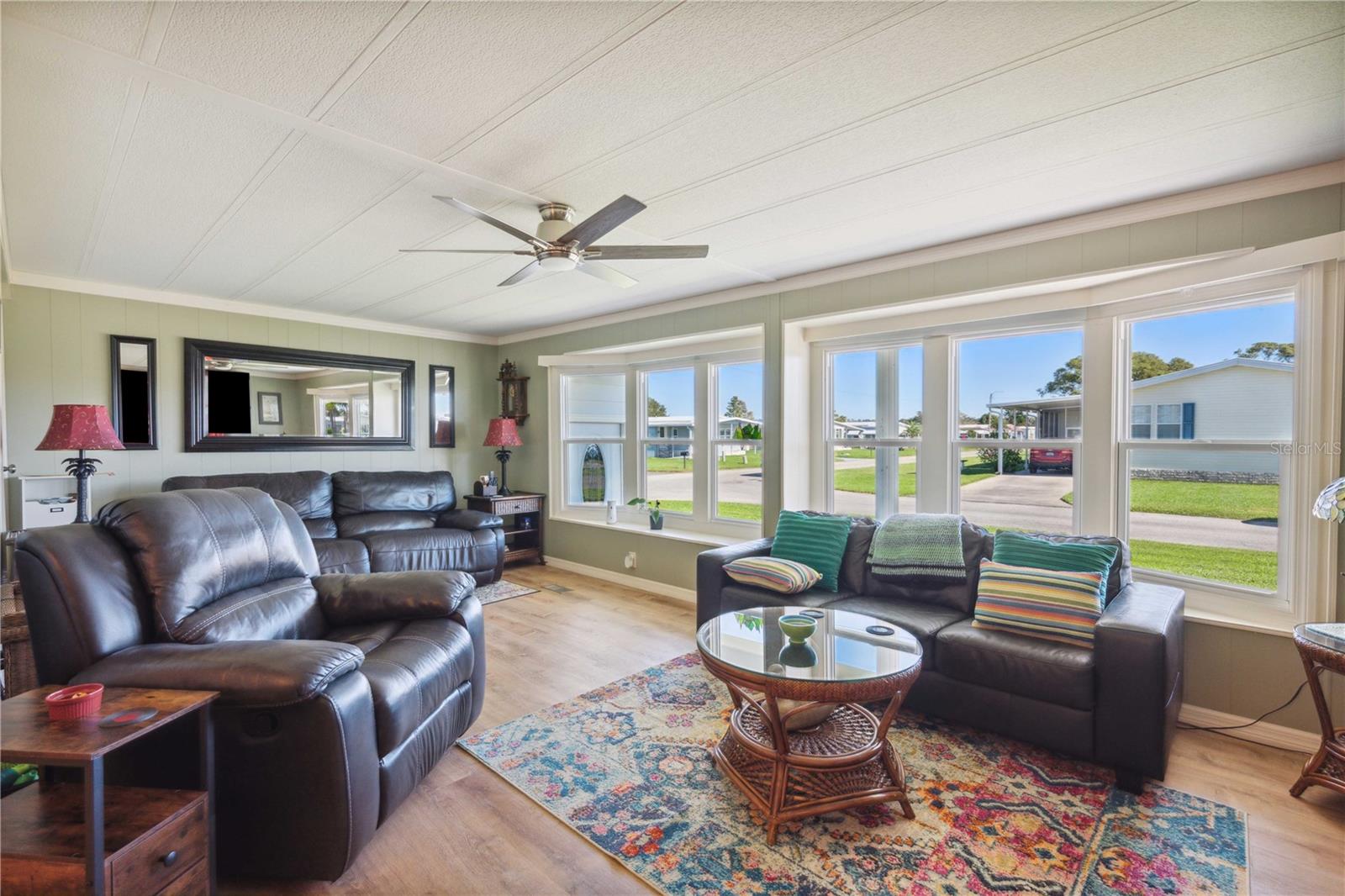 Many thermal windows in this bright open living room.