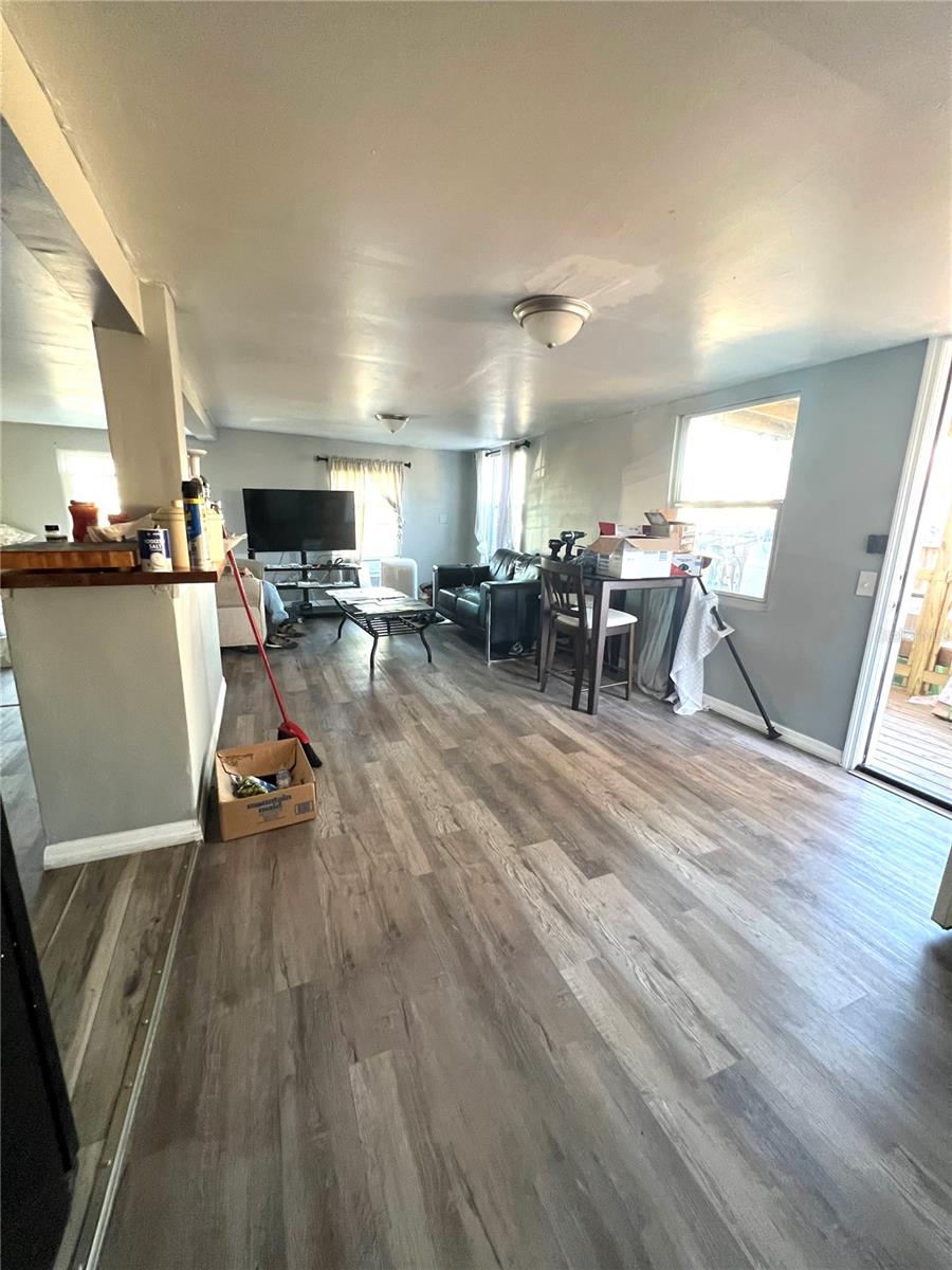 VIEW FROM MASTERBEDROOM LOOKING OUT INTO DINING AREA AND LIVING ROOM