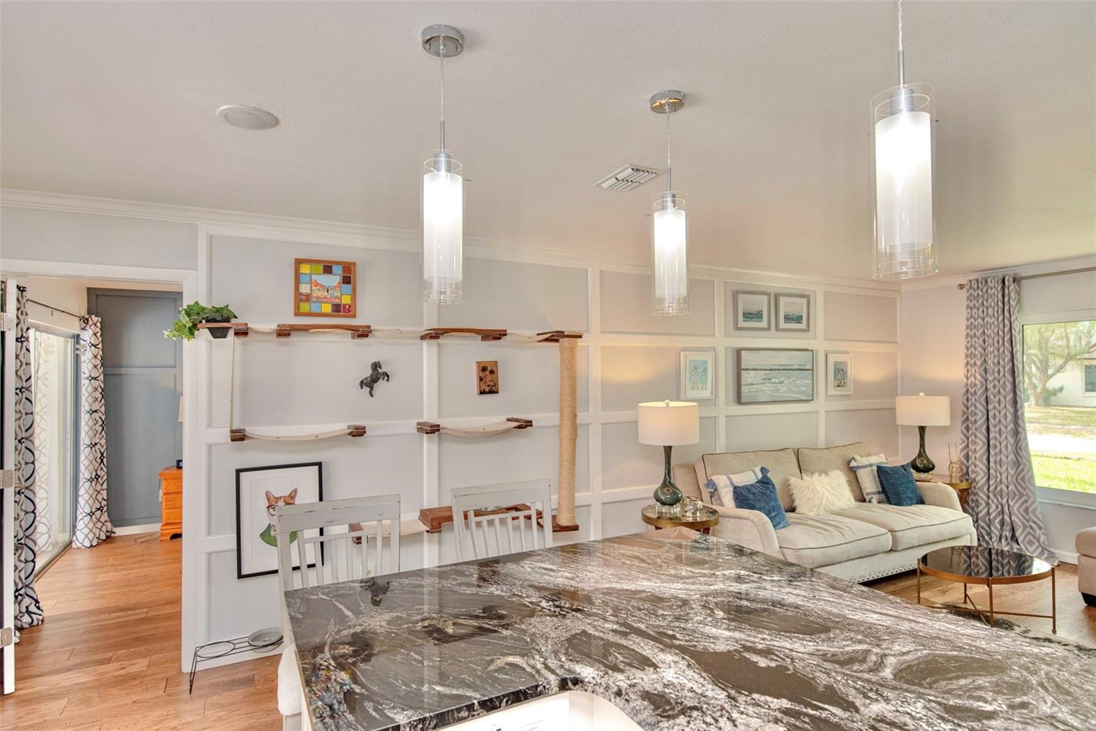 Breakfast bar and living room.