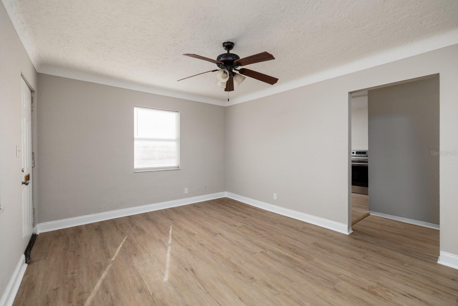 Living room w/Cove ceiling.