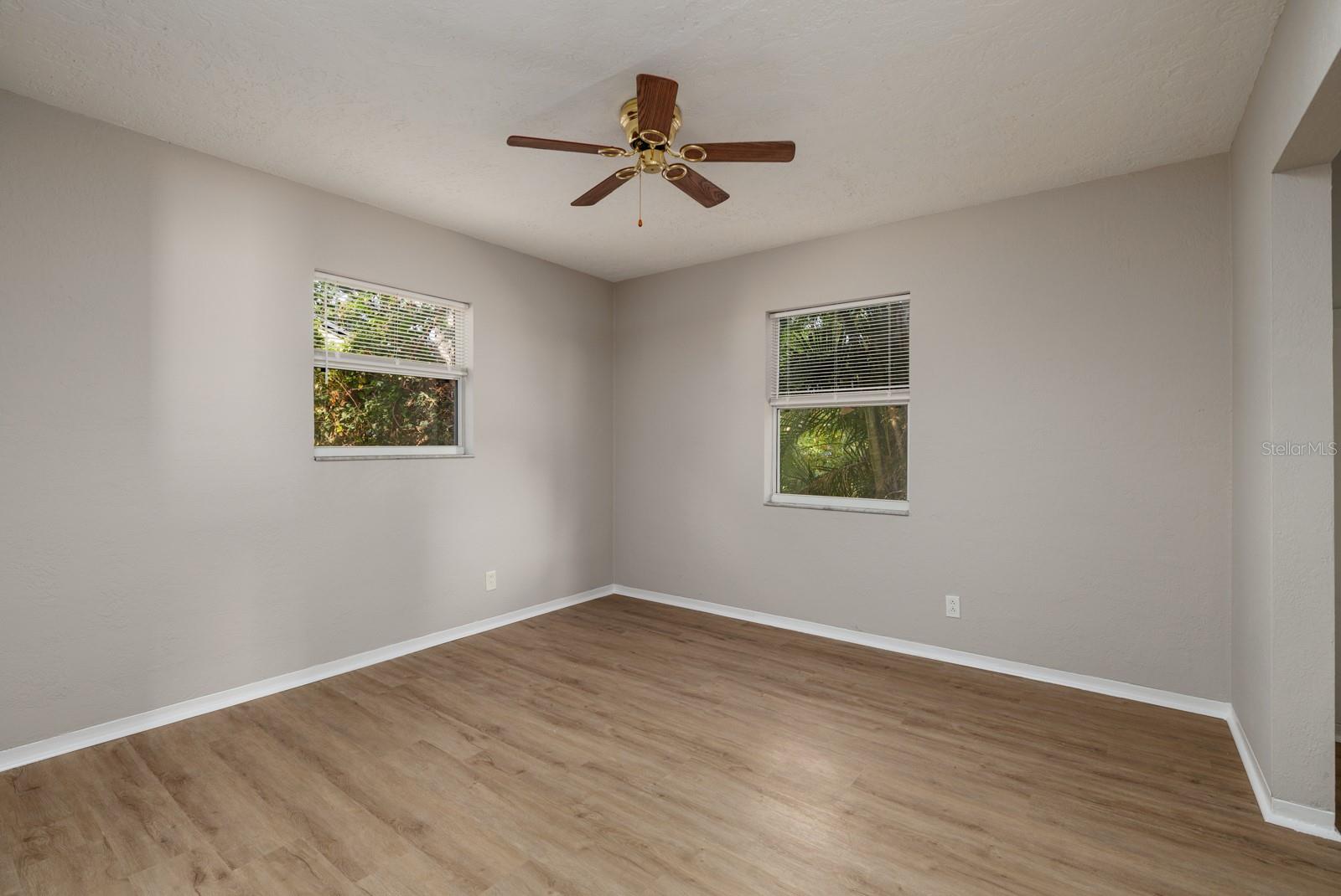 The primary bedroom is a corner room at the front of the house.