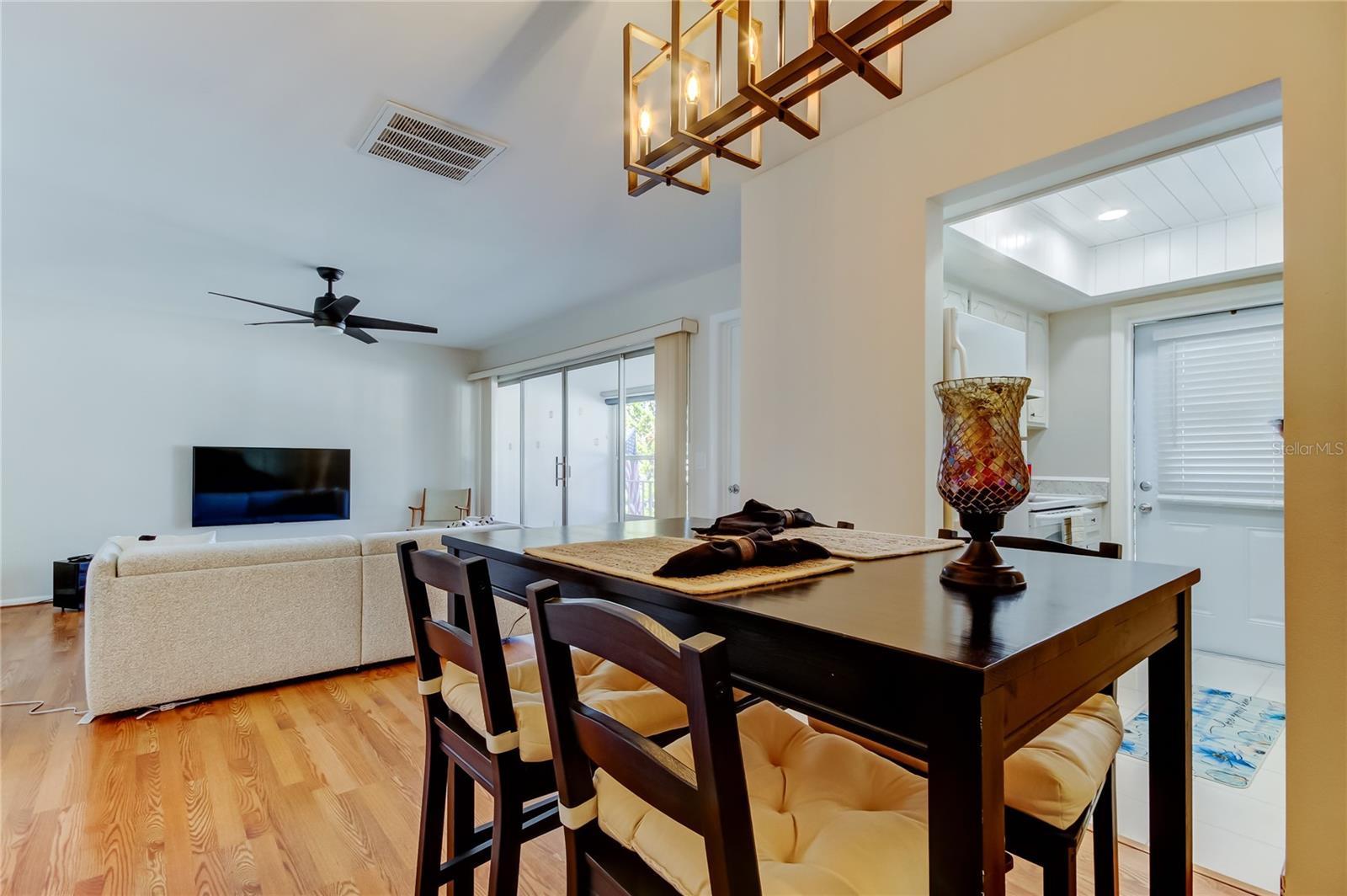 19. Dining Area Features a Brand New Chandelier.. Attractive Fixture Elevates the Space!