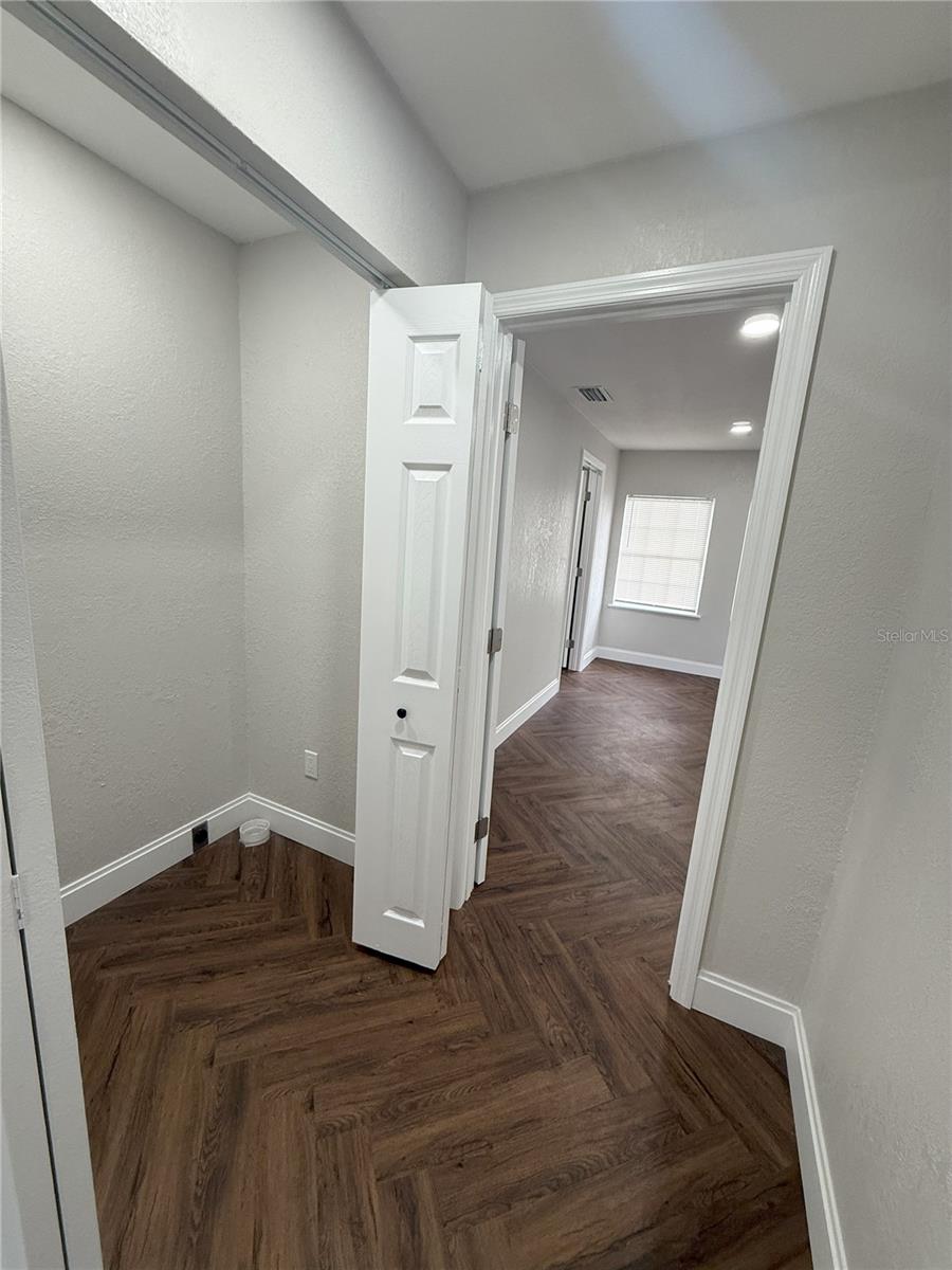 Hall going towards laundry and  primary bedroom