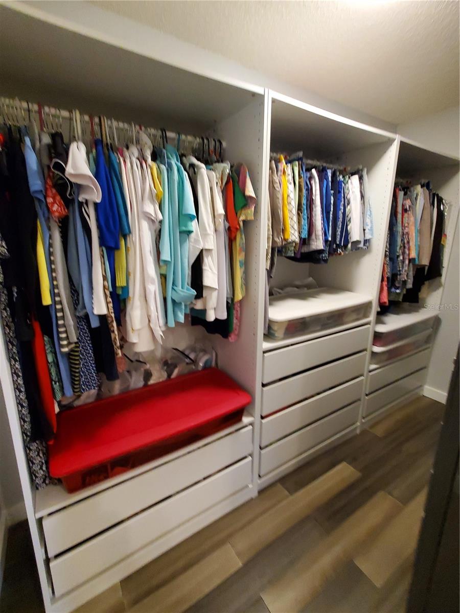 Modern Clothes Storage in Primary Walk-in Closet