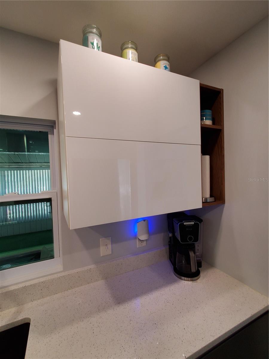 Contemporary Wall Cabinets. Note doors open up instead of to either side.