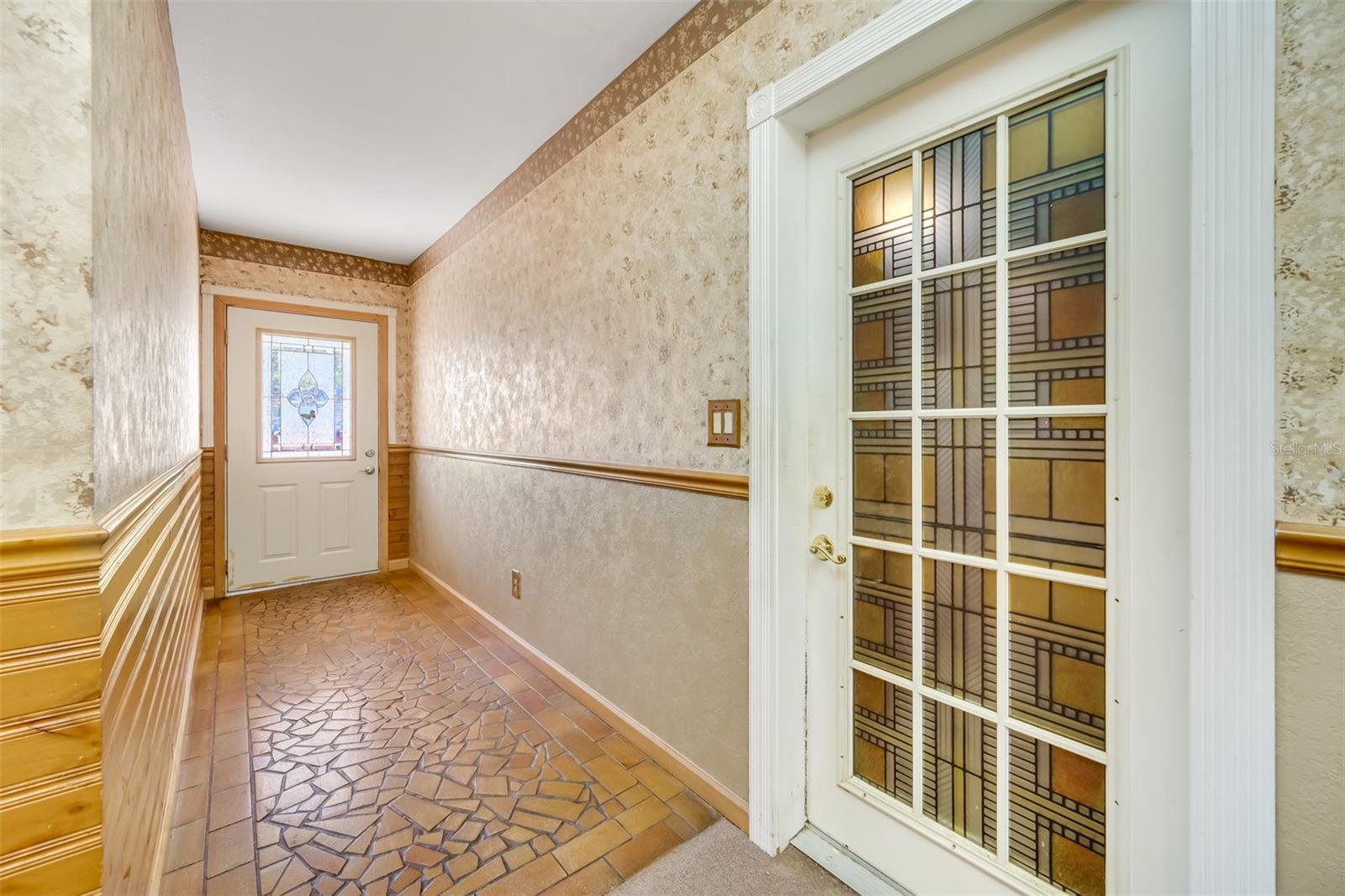 View of Foyer, Front Door and Door to Garage.