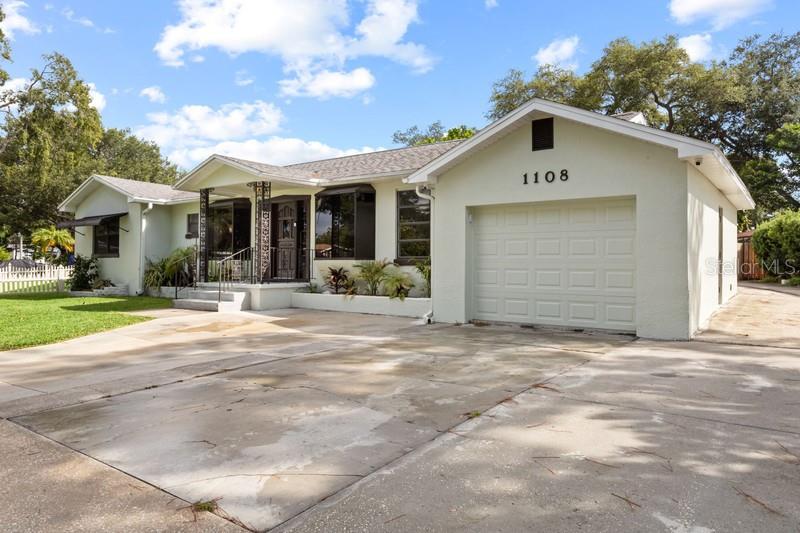 The home features an oversized, one car garage with plenty of parking spaces.