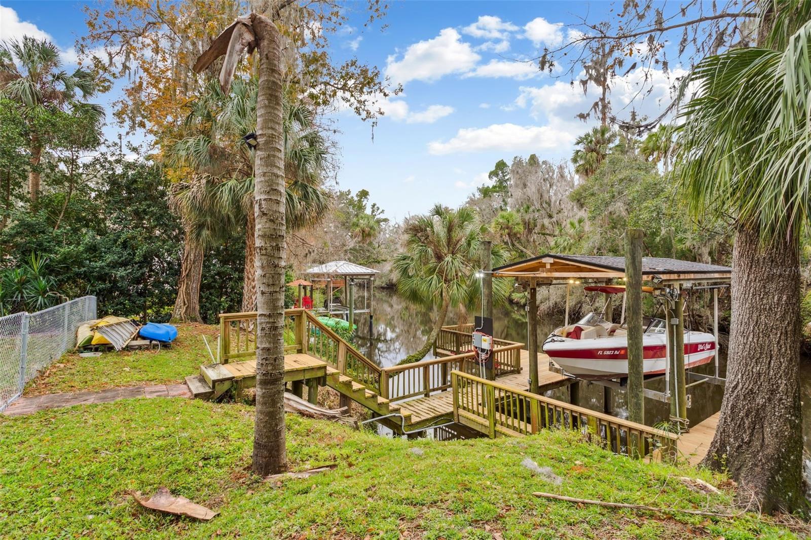 Private dock equipped with a covered 9,000 lb boat lift!