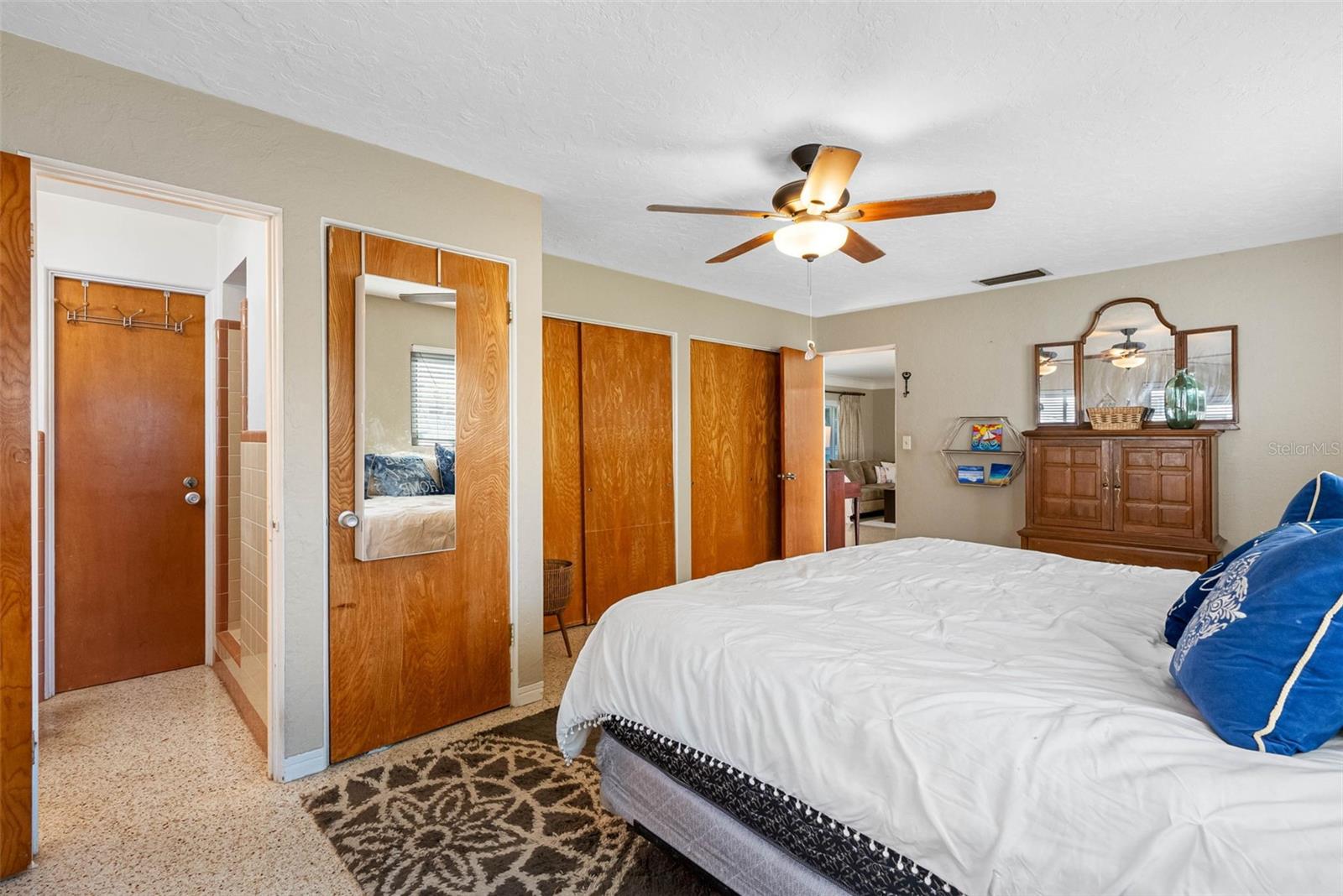 The primary suite boasts three closets, providing abundant storage and keeping your space tidy and clutter-free. And a door to the laundry rroom.