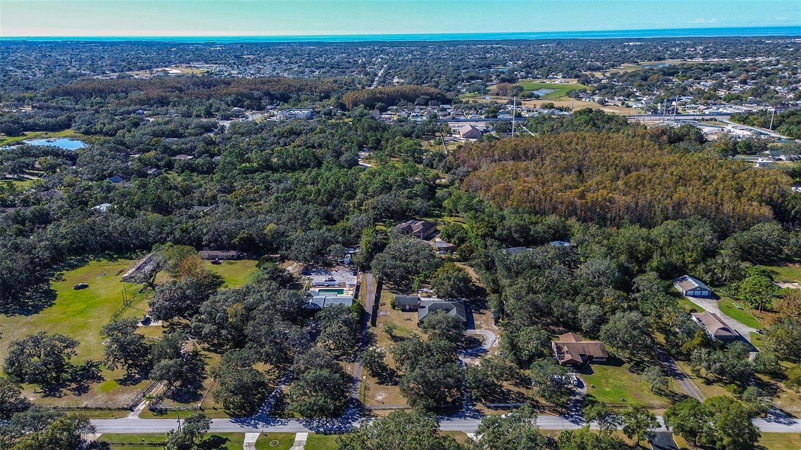 Aerial photo of home with circular driveway