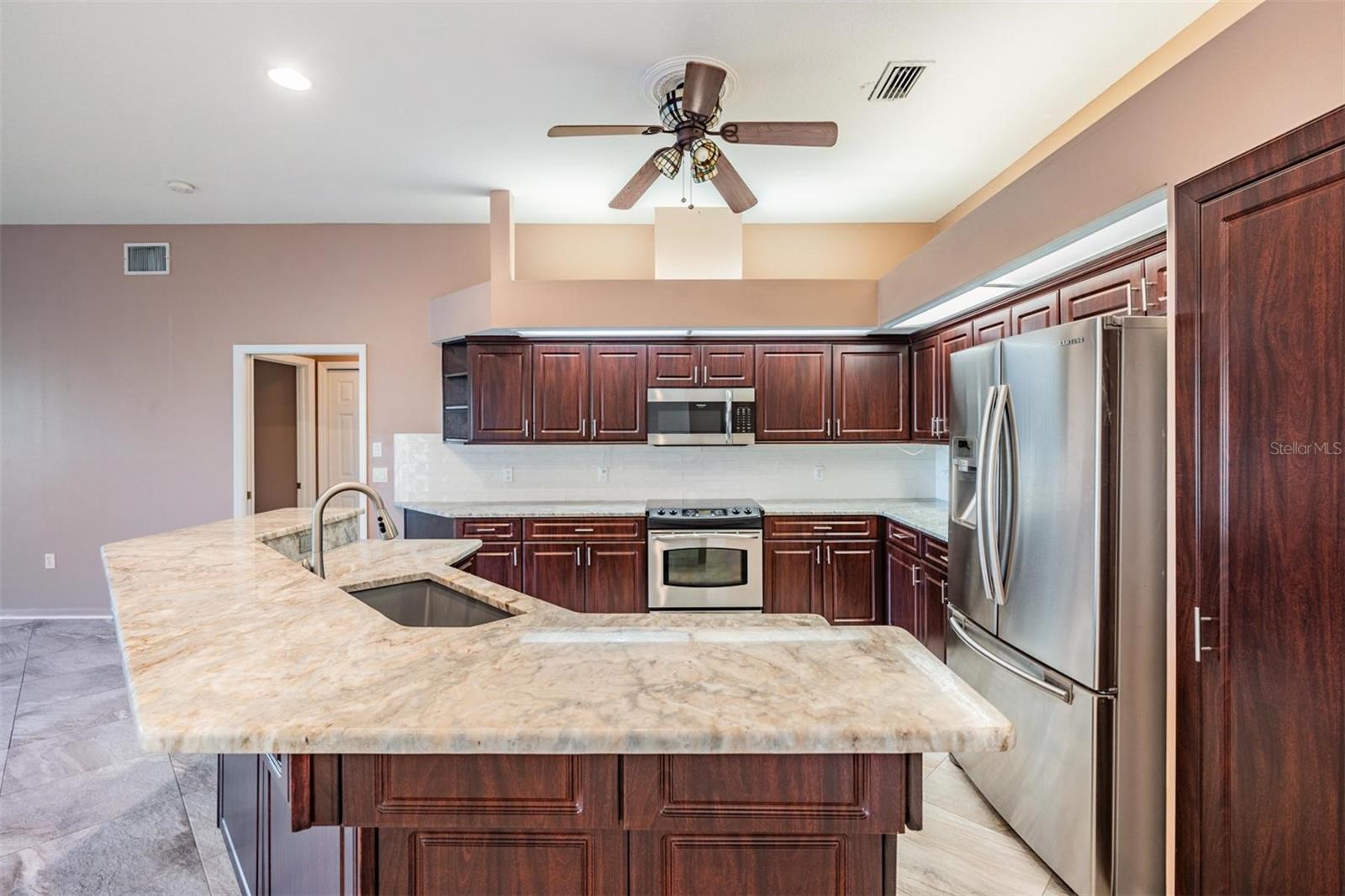 All stainless appliances with additional breakfast bar seating