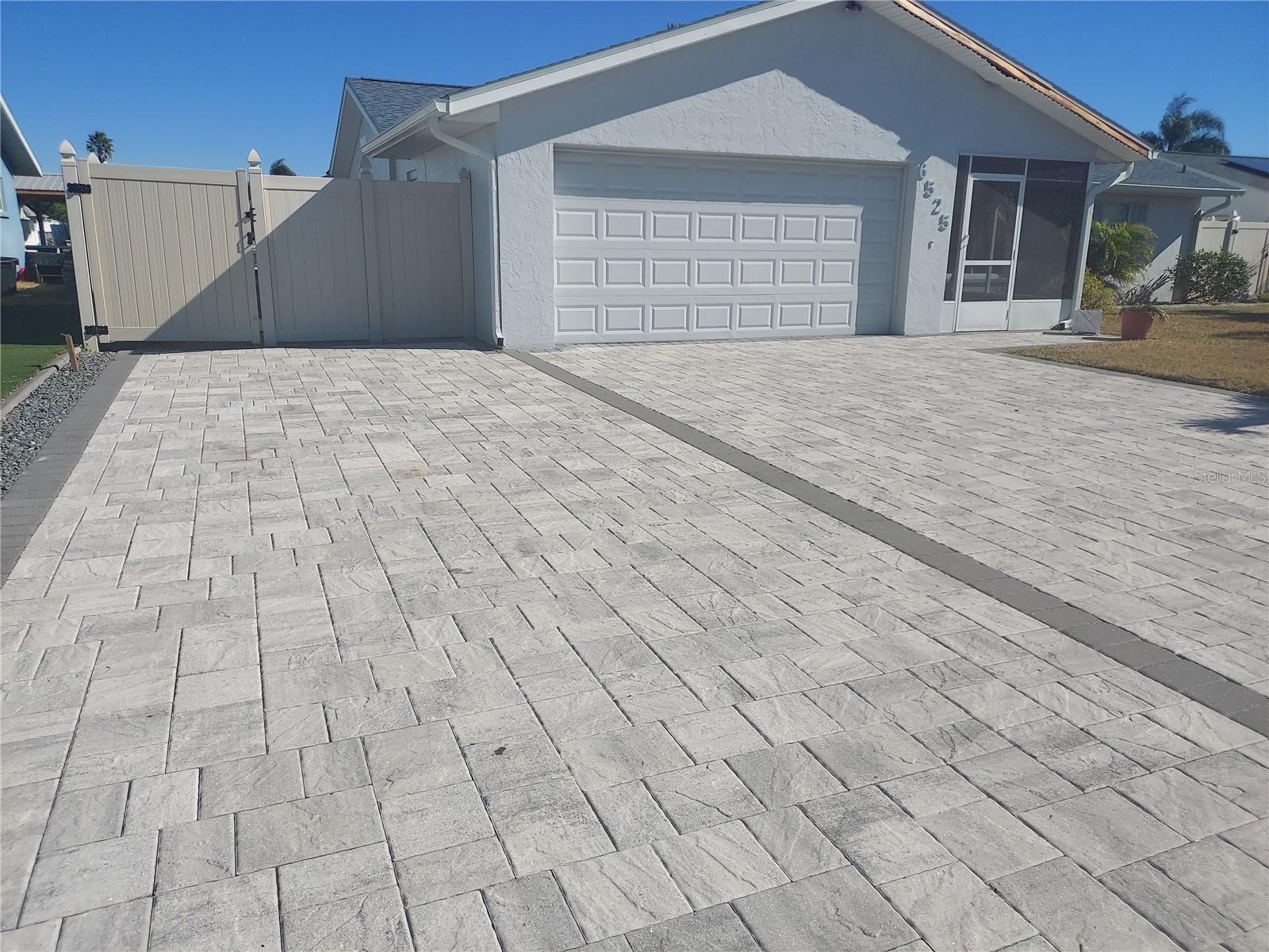 Gorgeous Pavers extended to RV or Boat Parking and 2 car garage