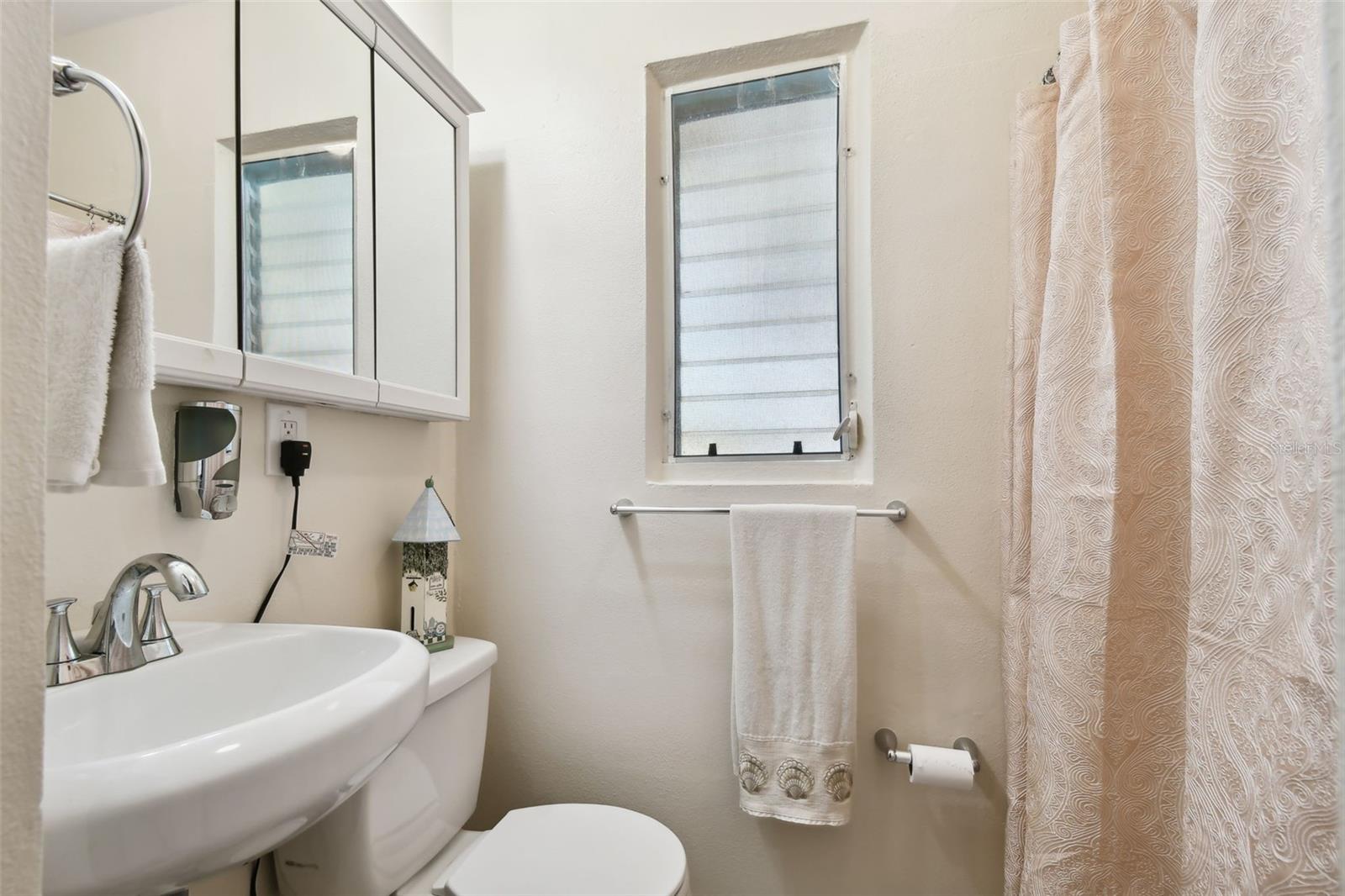 Vintage garage bath with mosaic floor/shower tiles...in good shape!