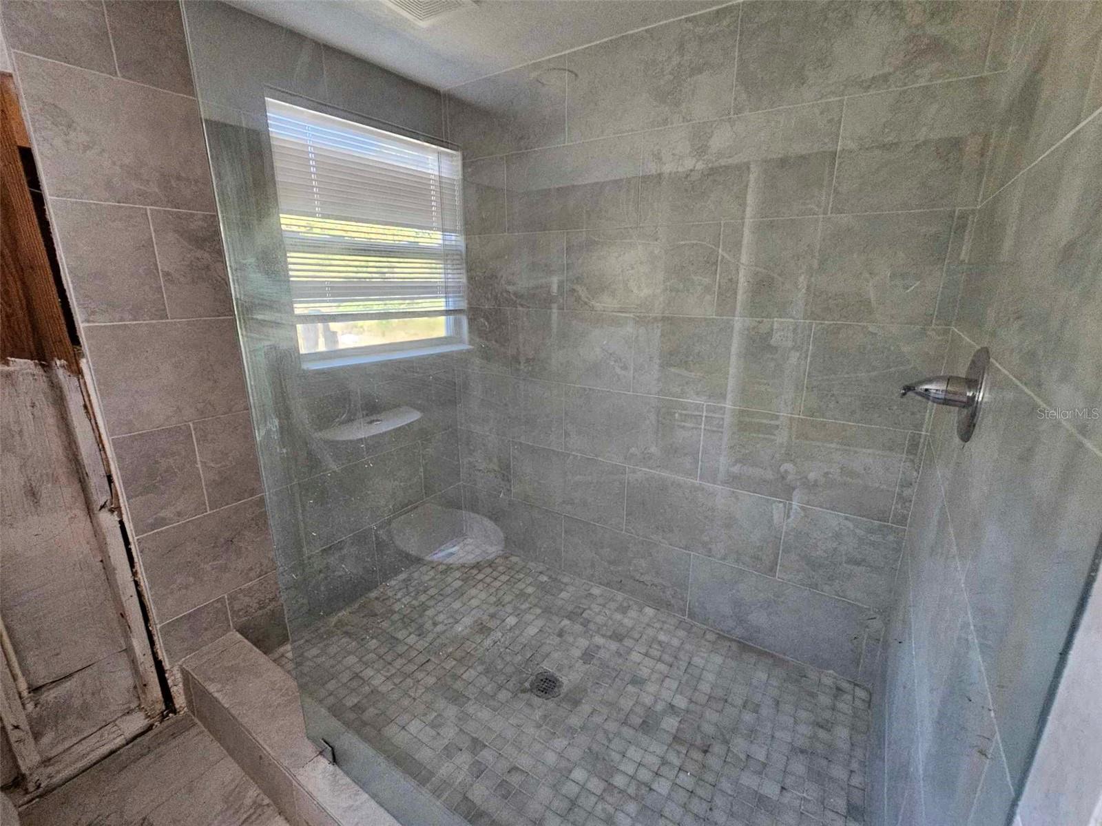 HUGE primary shower completely intact