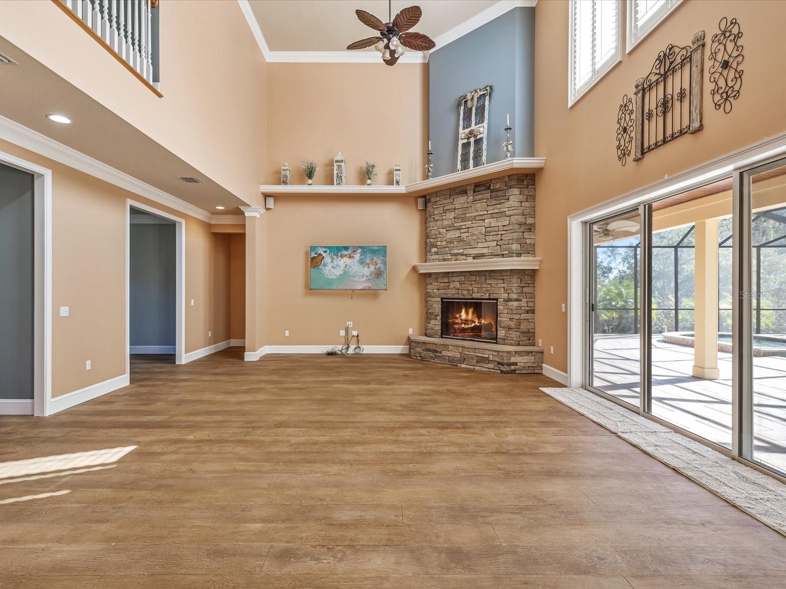 high ceilings and sliders to pool and fun