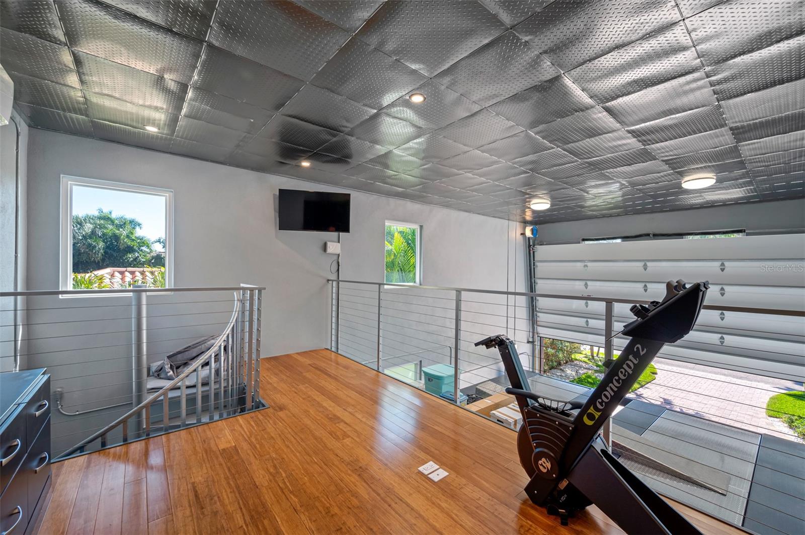 Air conditioned loft in the garage, great for a gym or additional office