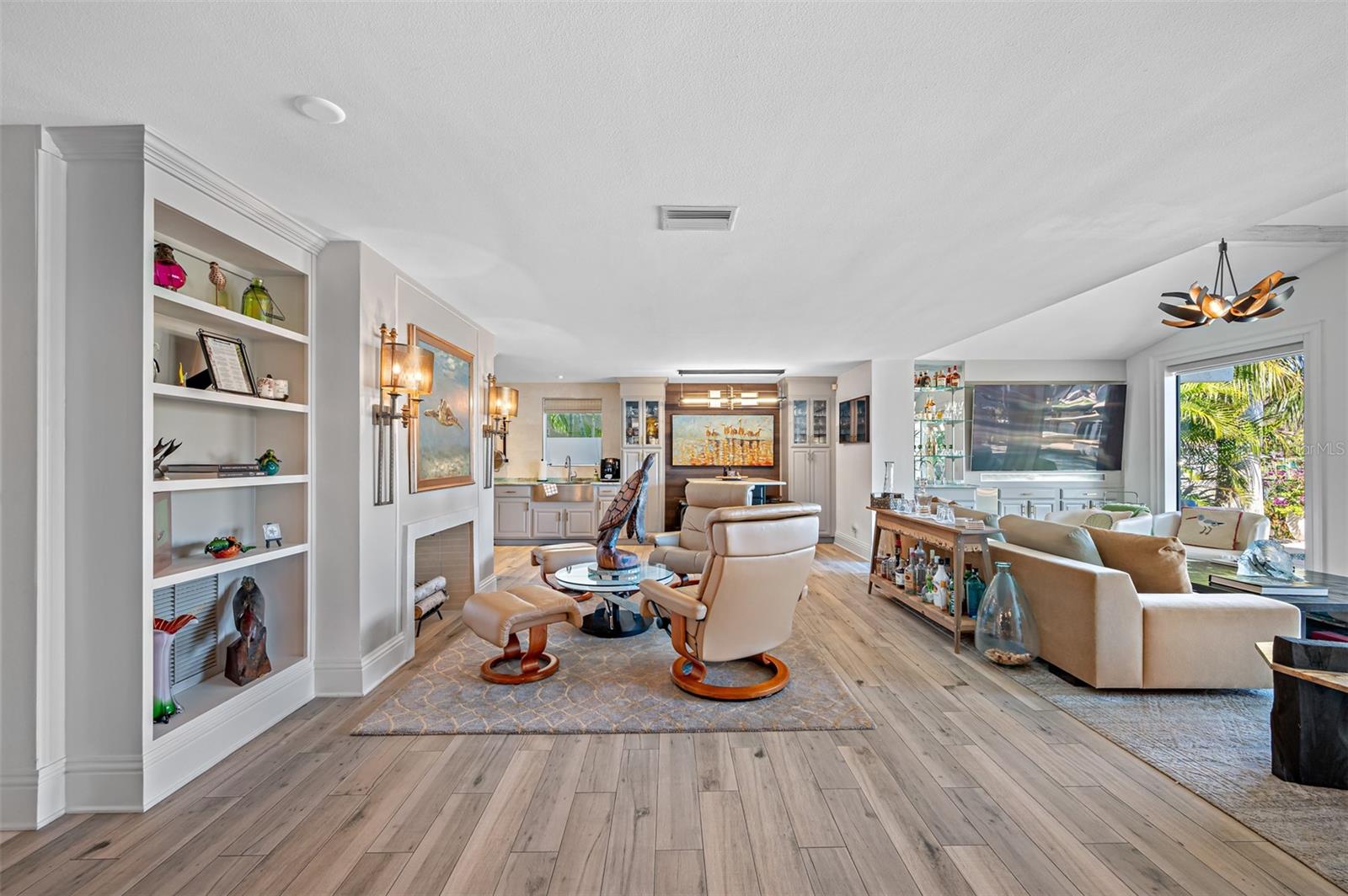 Family room with built in shelves and fireplace