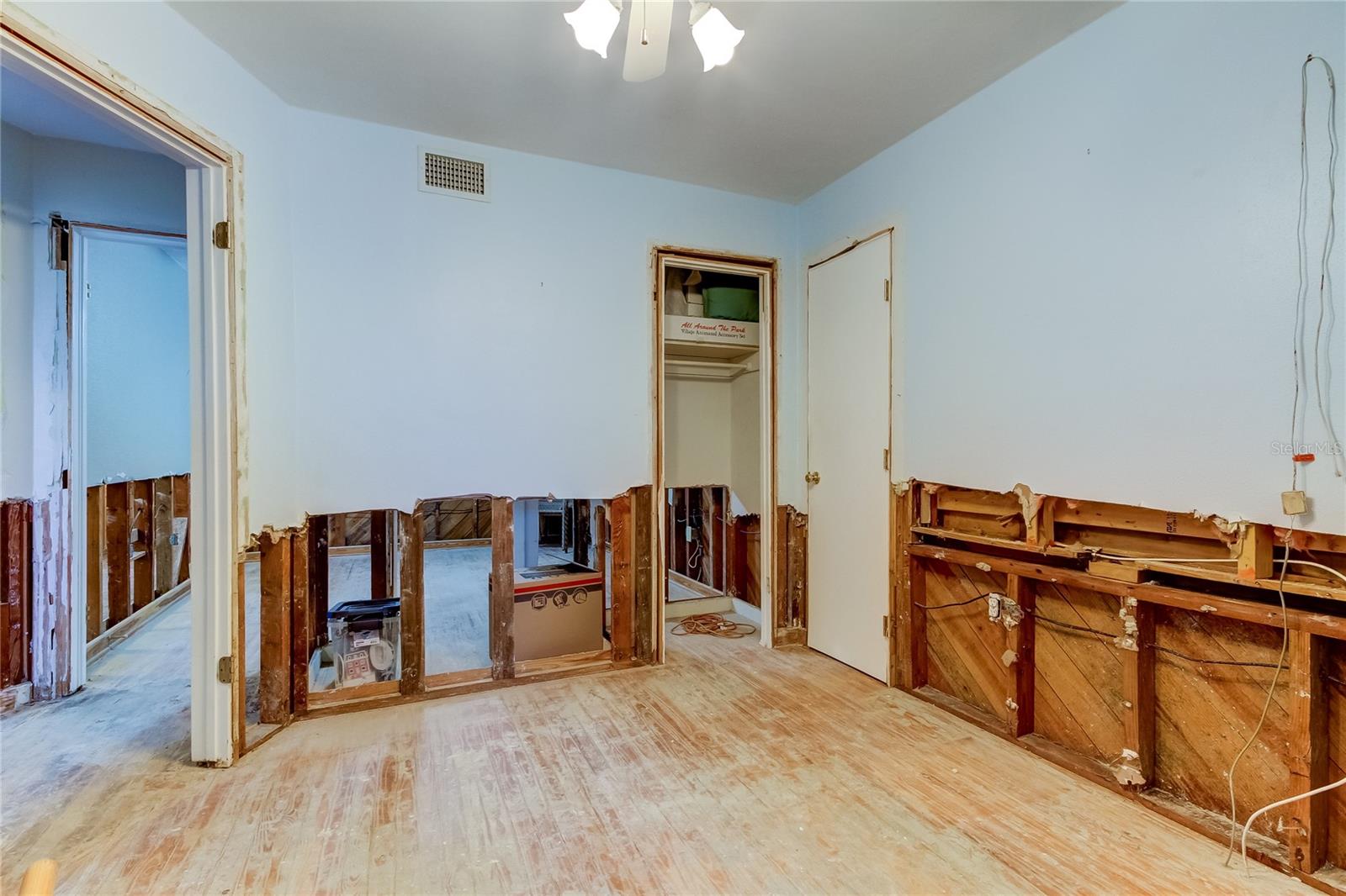 Bedroom Two Downstairs - Showing Door to Workshop at Right