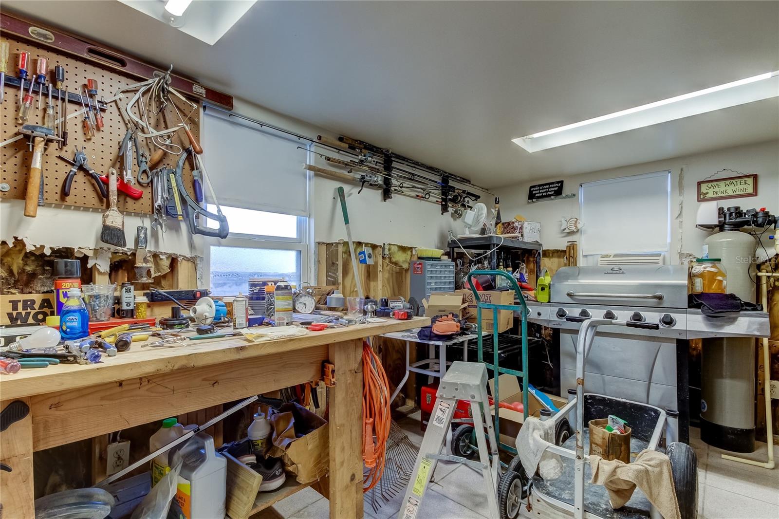 Workshop-Washer and Dryer Hook ups (not shown) Enter from Carport or Bedroom Two Downstairs - Loads of Storage Above the Workshop