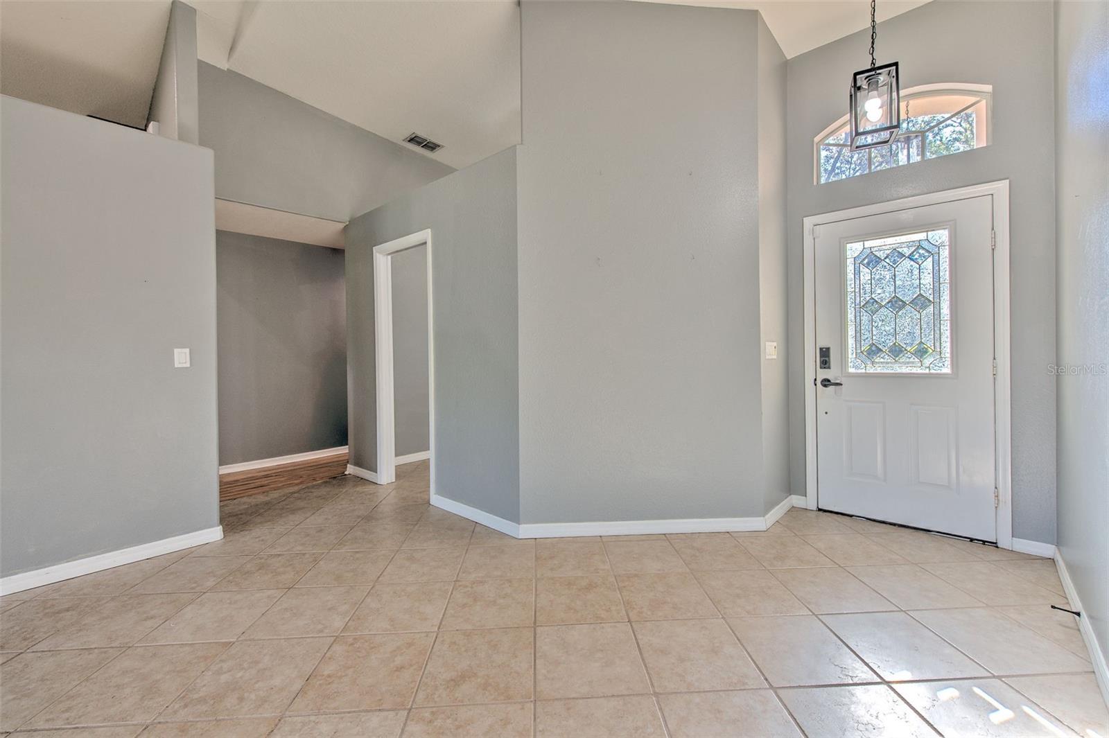 Entry to family room and hallway to bedrooms 1, 2 and 3 and doorway to versatile room