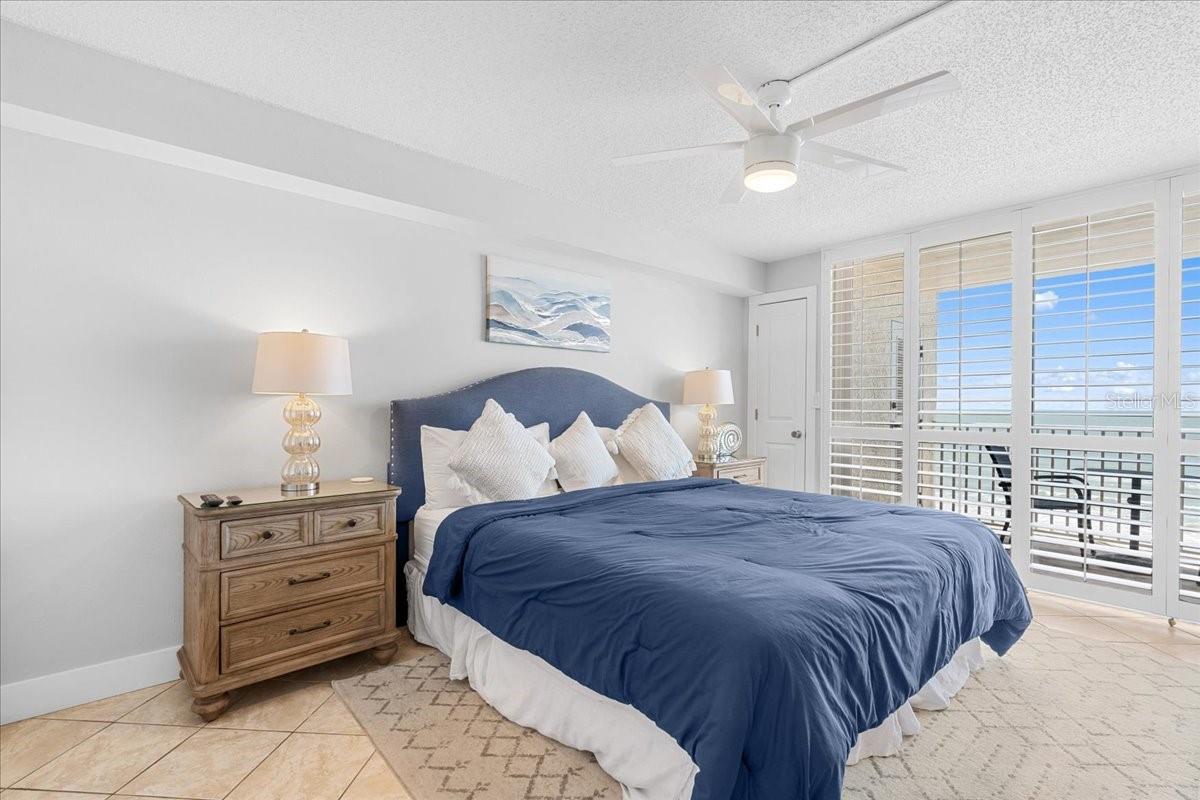 Primary Bedroom with balcony access.