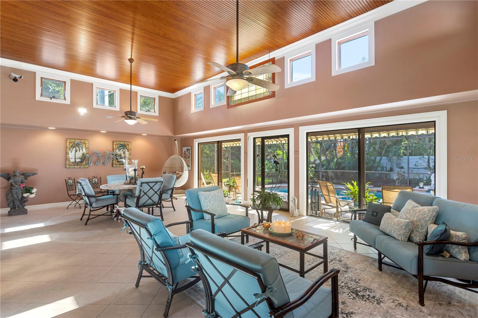 14 ft custom wood ceiling, screened room overlooking pool