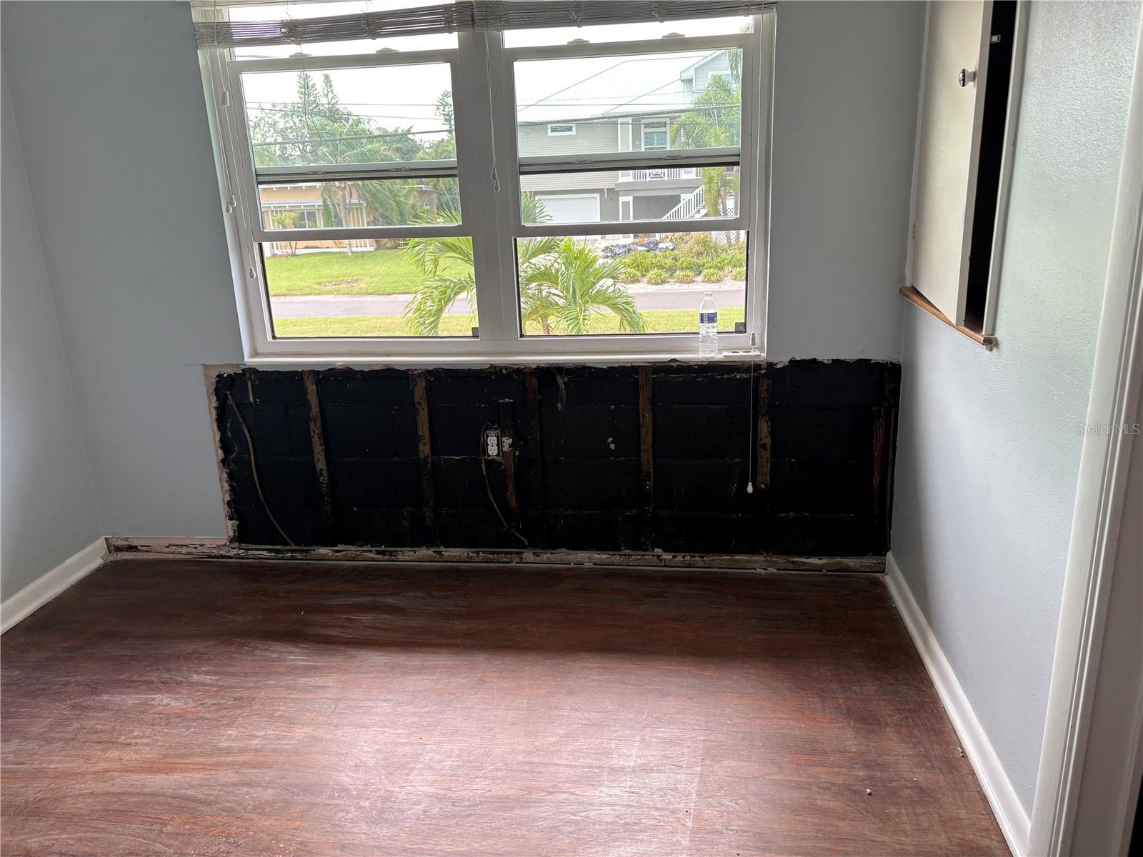 bedroom 2 with wall removed due to water intrusion from window during Hurricane Milton