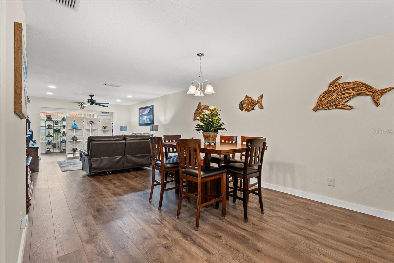 The new laminate flooring flows effortlessly from the kitchen all the way to the Florida room.