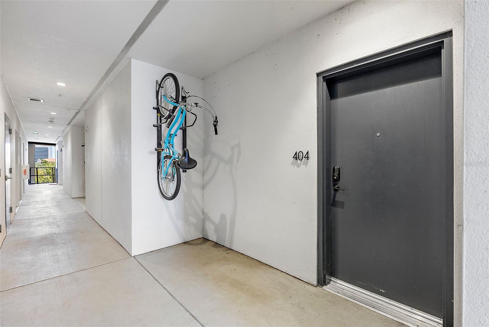 Front Door Entry into Unit 404, complete with two bike racks.