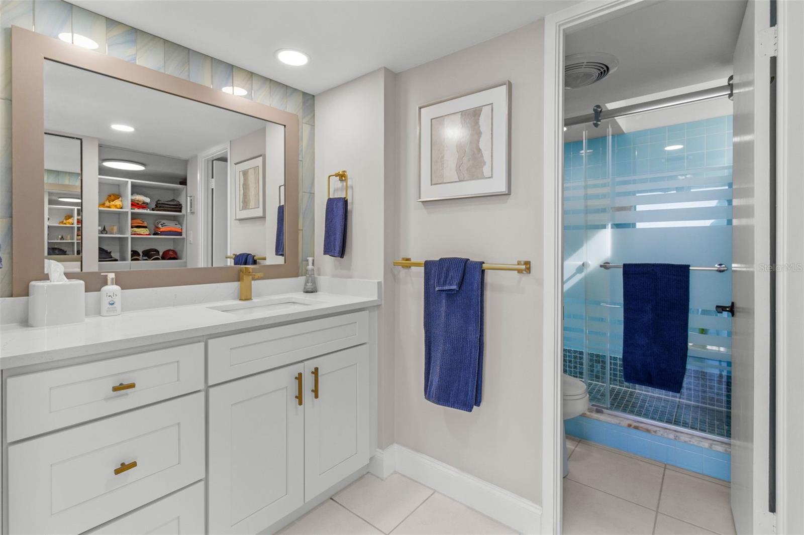 The ensuite bathroom has been tastefully updated, offering modern elegance, while the spacious walk-in closet provides ample storage.