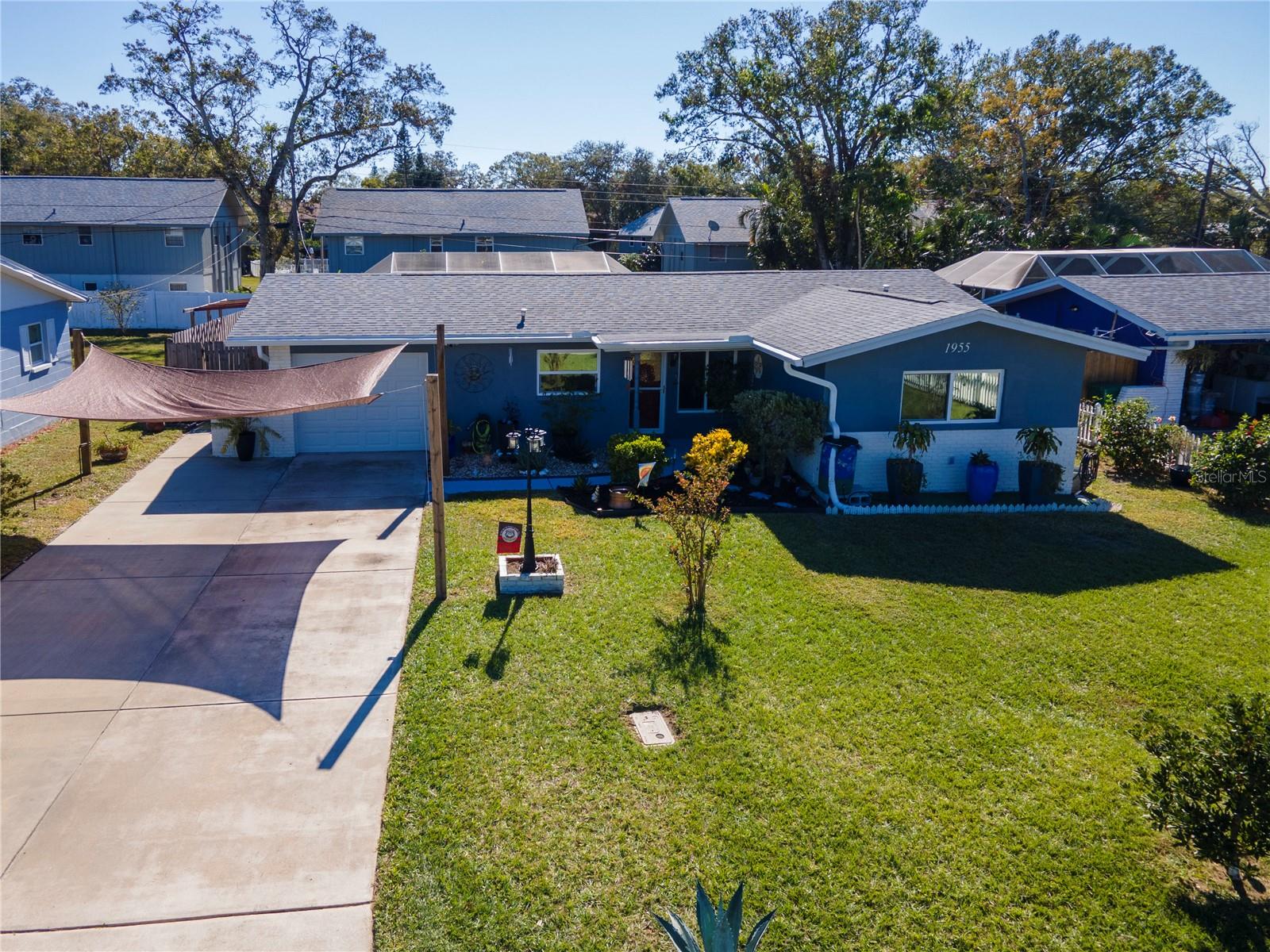 1955 Ashland Drive front view of home.  Check out the gorgeous yard and double driveway.