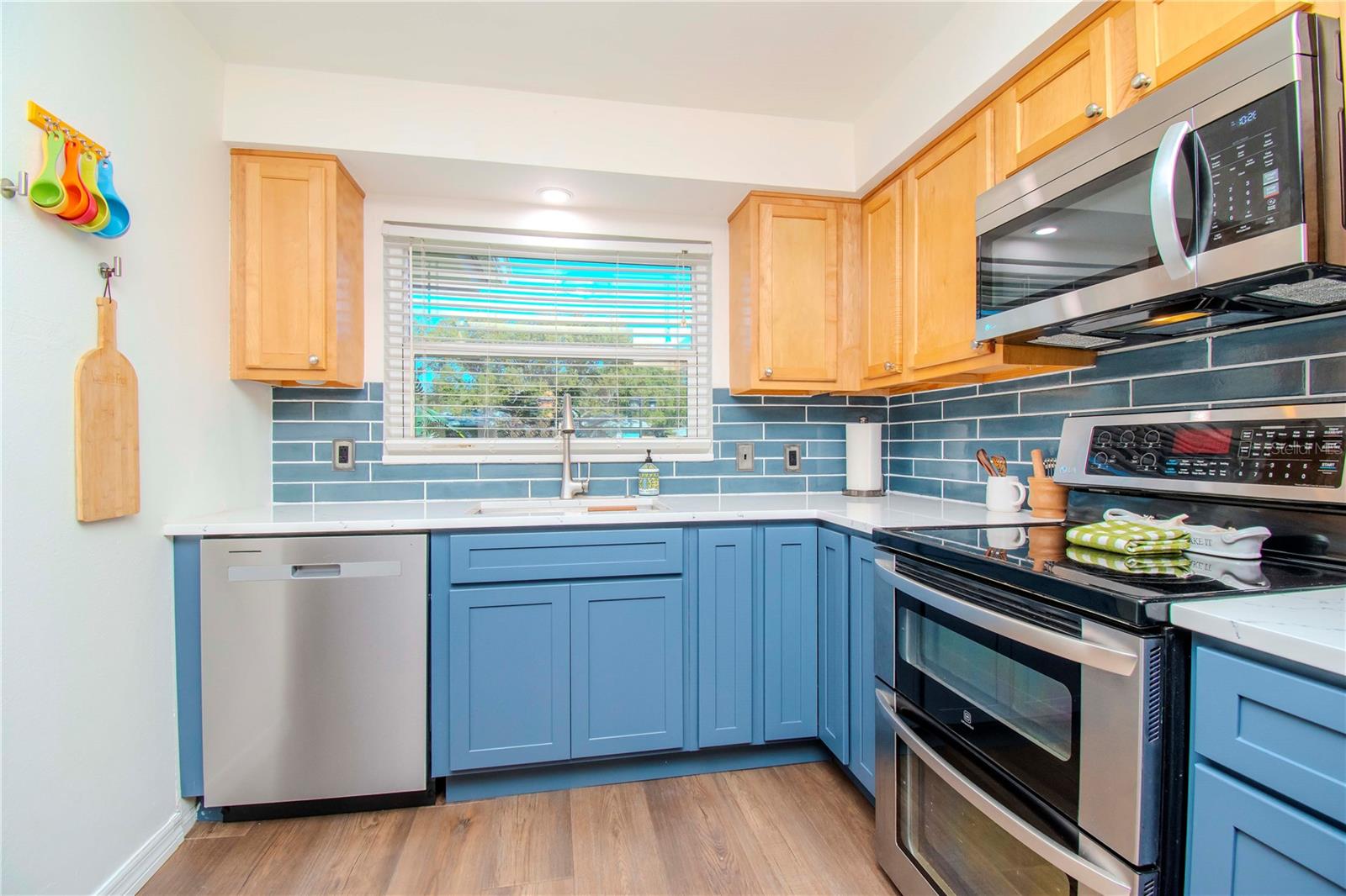 View of double oven and dishwasher.