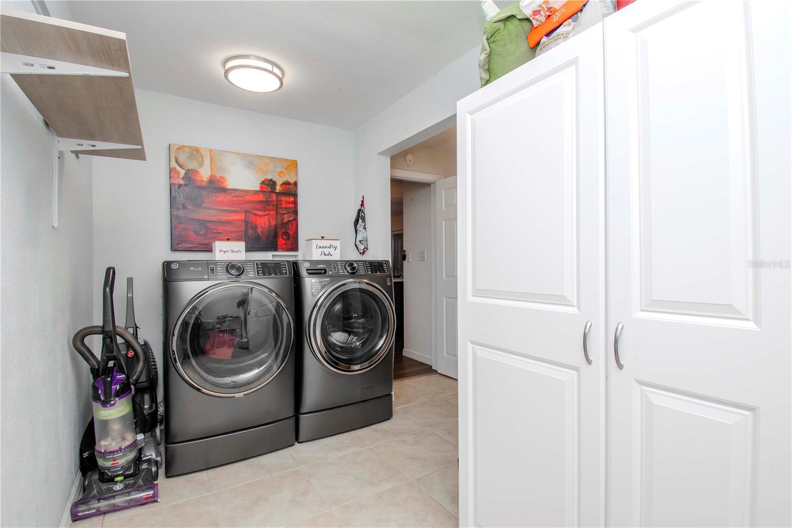 Inside laundry room, climate controlled and not included in square footage.  Part of the garage conversion.